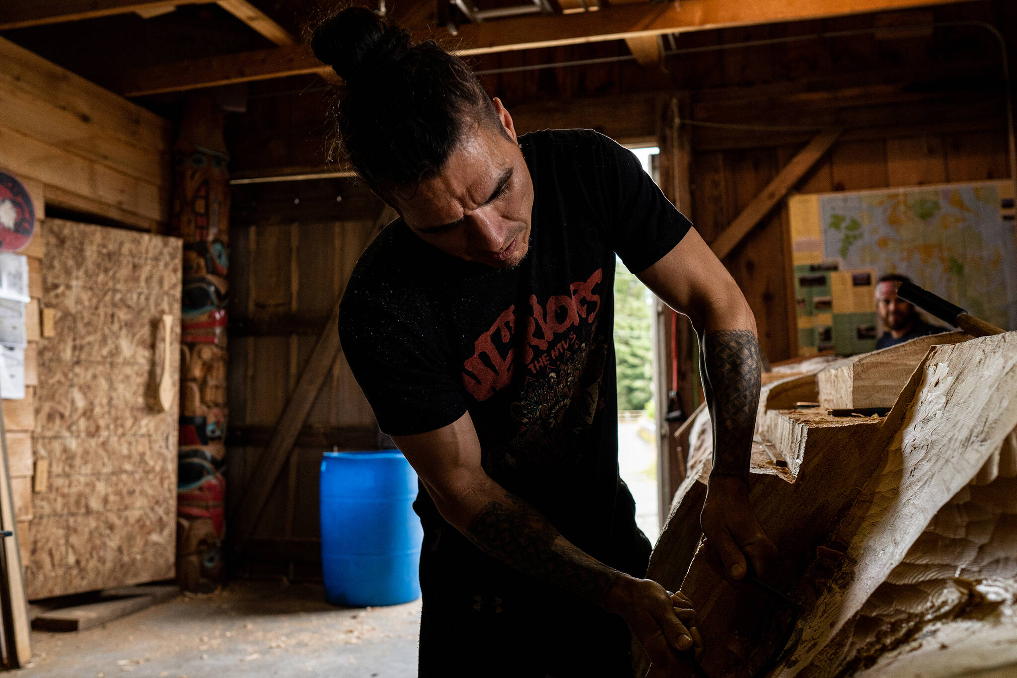 The Hydaburg Carving Shed is a community space for healing. Sgwaayaans (TJ) Young aligns head, heart, and hands during carving.(Courtesy Photo /Ash Adams for Visit Southeast)