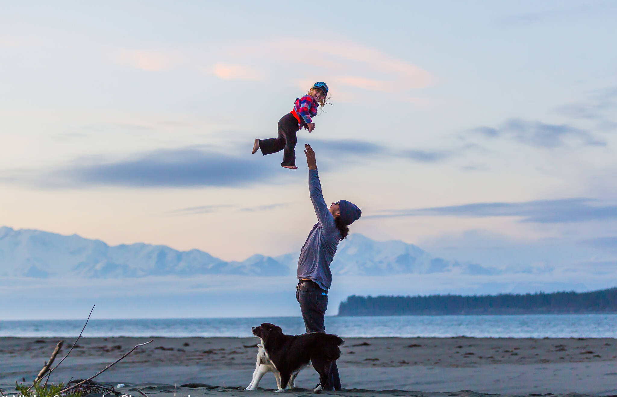 Joy and love are on full display during a sunset on one of Yakutat’s iconic beaches. (Courtesy Photo / Violet Sensmeir)