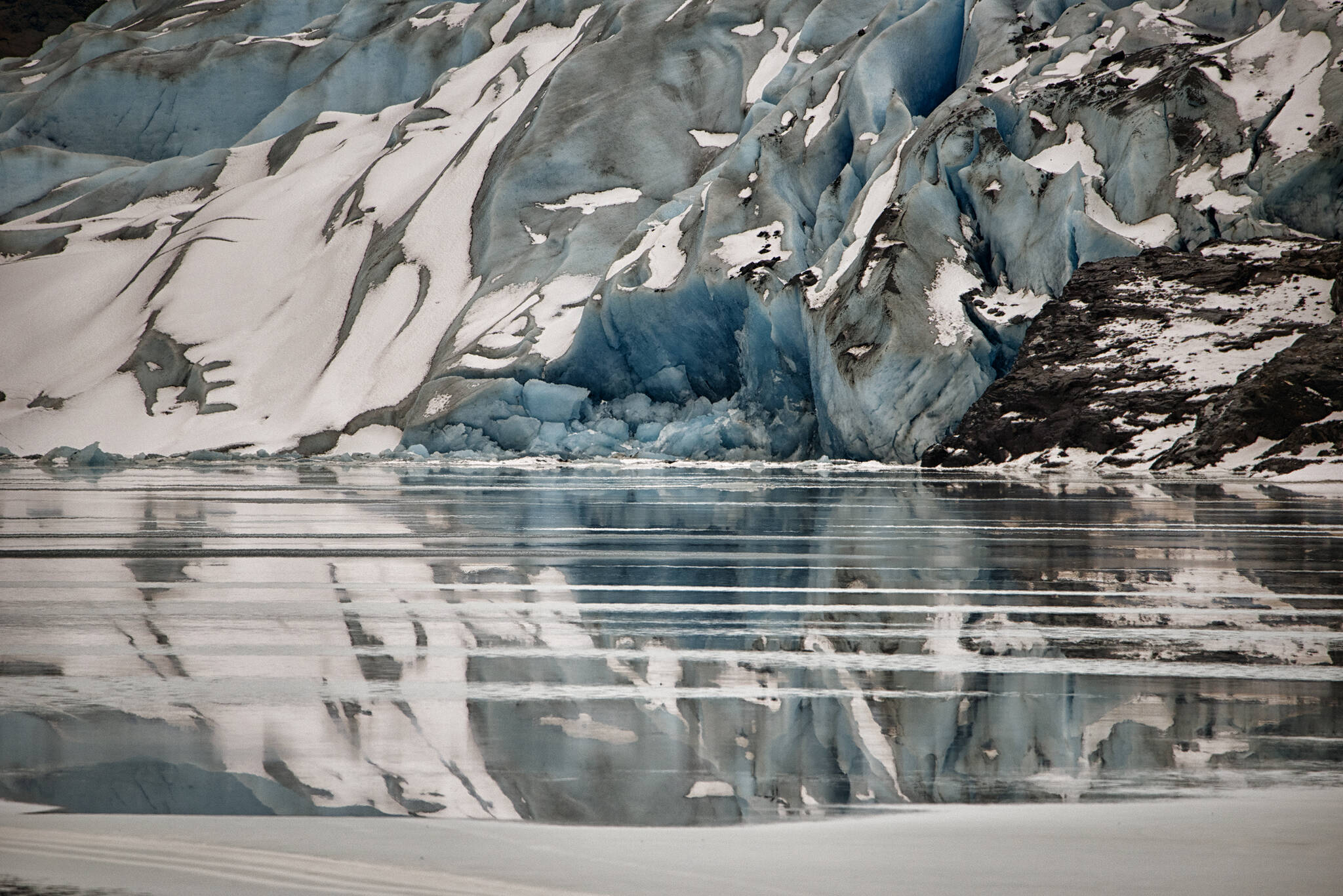 The Mendenhall Glacier with freshly calved blue ice touching fresh water. (Courtesy Photo / Kenneth Gill, gillfoto)