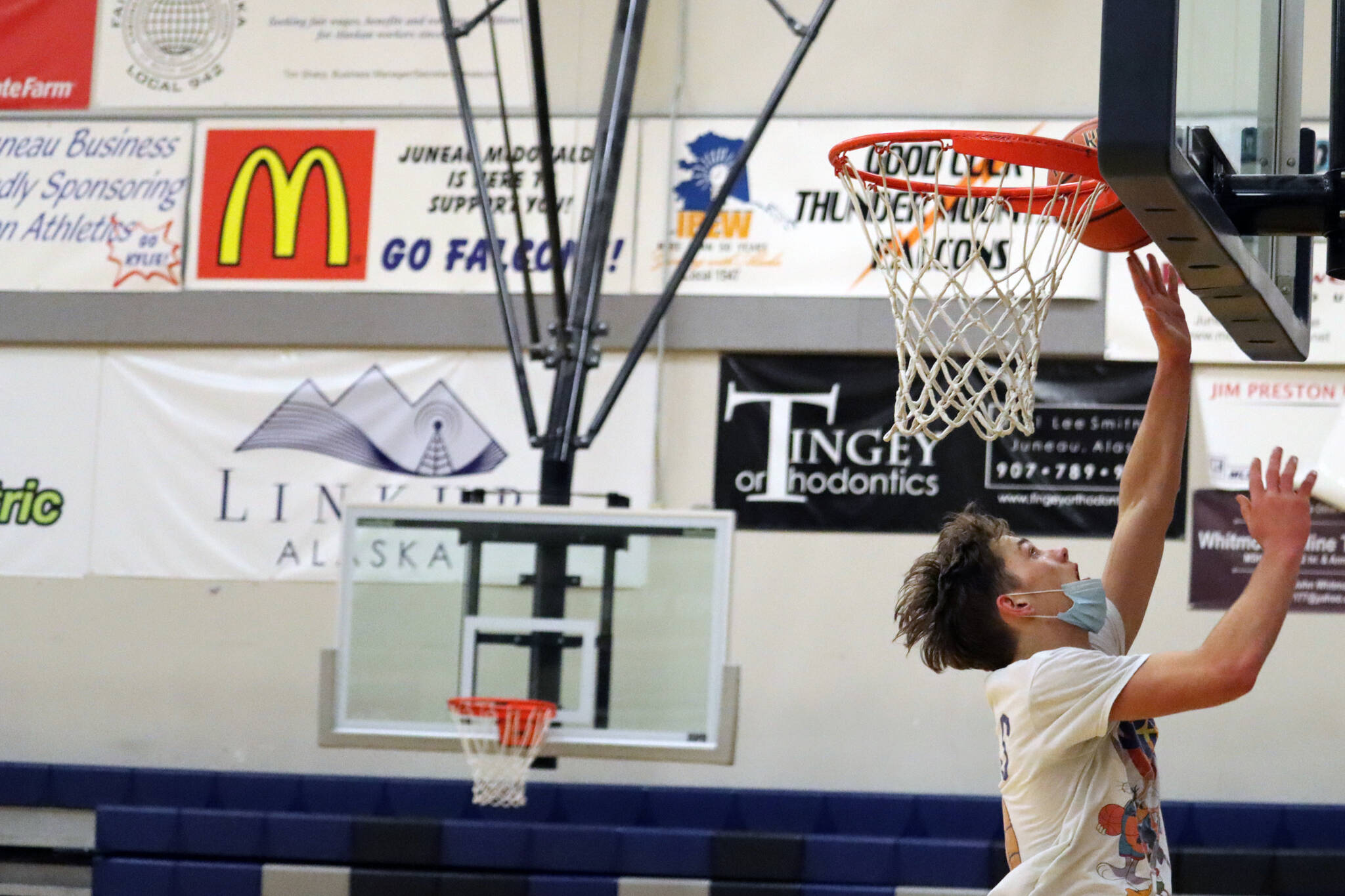Wallace Adams goes up for a layup during practice at Thunder Mountain High School. (Ben Hohenstatt / Juneau Empire File)