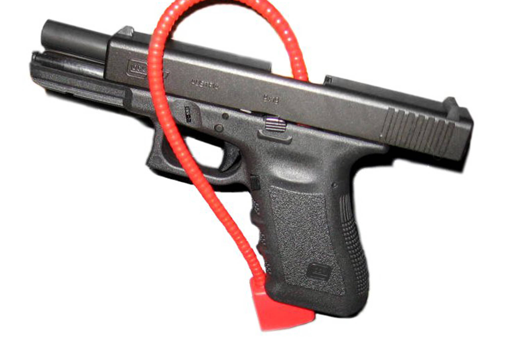This image available under a Creative Commons license shows a handgun locked with a cable gun lock.
