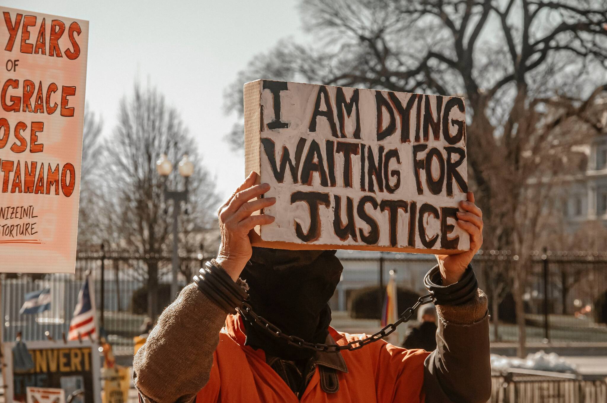 Demonstrators outside the White House on January 11, 2022, commemorating the 20th anniversary of the Guantanamo Bay Detention Center. (Maria Oswalt / Unsplash)