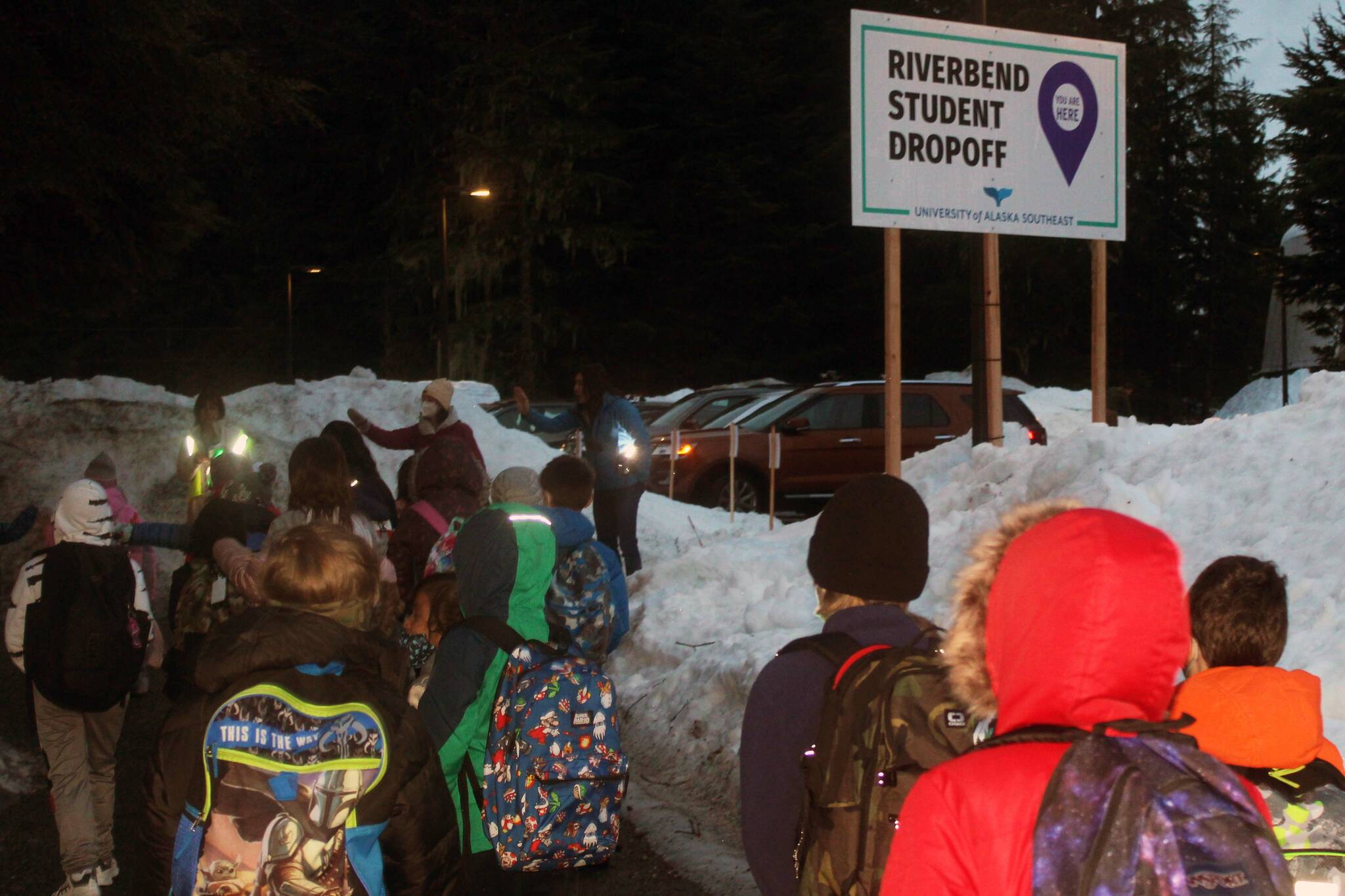 Students from Riverbend Elementary School arrive for their first day of classes at Chapel By the Lake on Jan. 24. The church offered its education wing to the Juneau School District after a burst pipe shuttered the Riverbend school building. (Dana Zigmund/Juneau Empire)