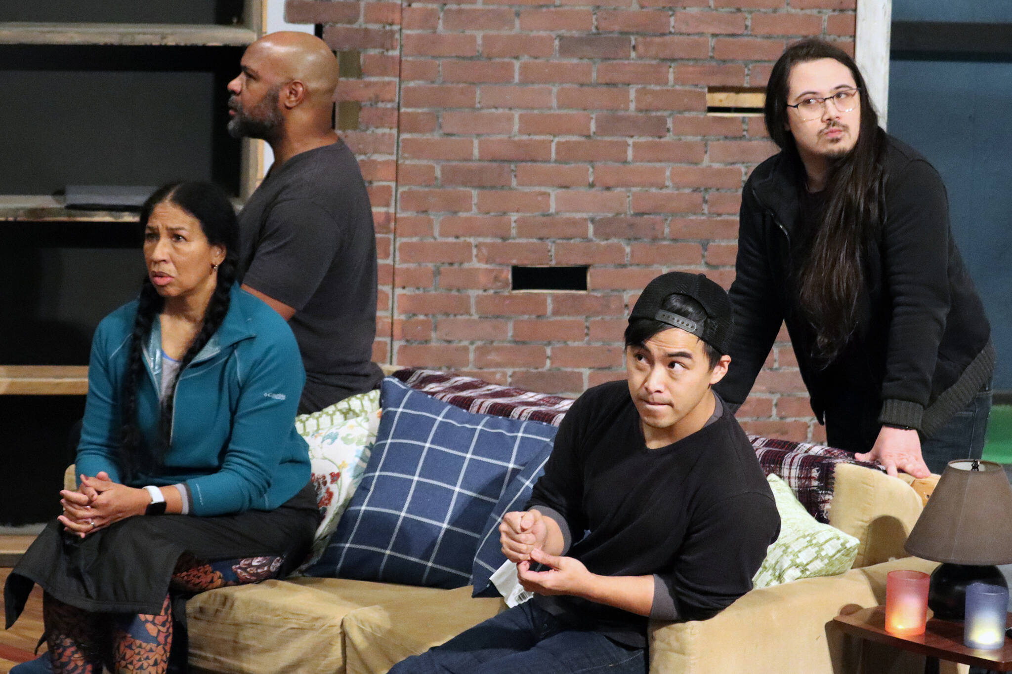Felix (Eddie Jones ), Vivian Melde (Della), Max (Mike Rao) and  Visarut  (Phai Giron) sit on high alert for signs of the supernatural during a rehearsal of "Brothers Paranormal" at Perseverance Theatre. The play, which opens Friday tells the story of two Thai American brothers hired by a Black couple to investigate a ghost. (Ben Hohenstatt / Juneau Empire)