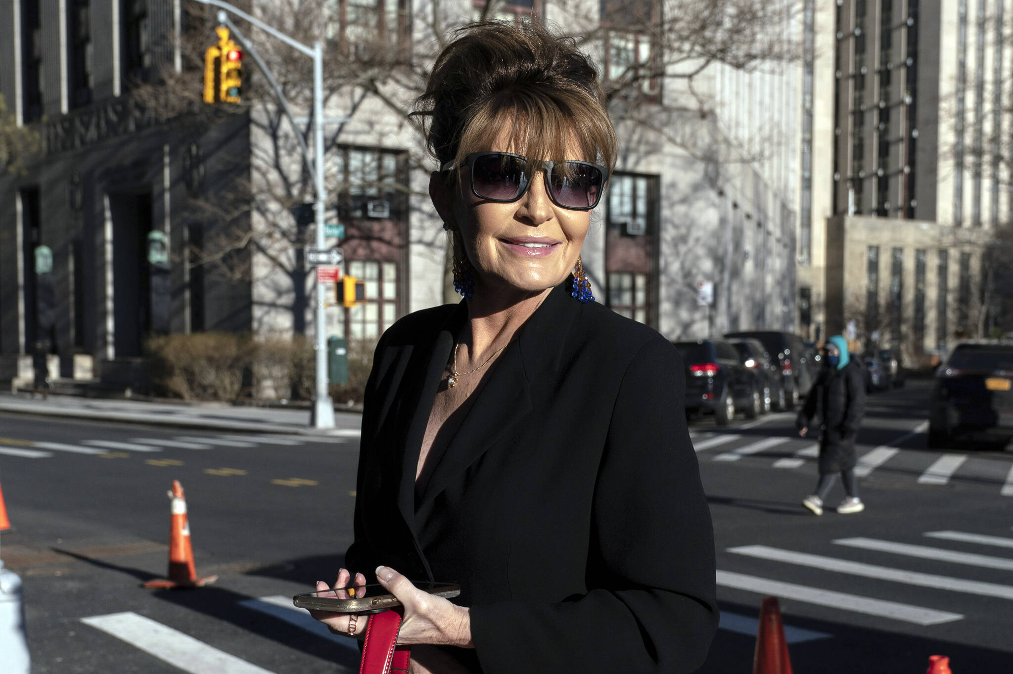 Former Alaska Gov. Sarah Palin arrives at federal court in New York, Feb. 11, 2022. A judge said Monday he’ll dismiss a libel lawsuit that Palin filed against The New York Times, saying Palin had failed to show that The Times had acted out of malice, something required in libel lawsuits involving public figures. (AP Photo / Jeenah Moon)