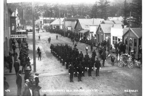 African-American soldiers of Company L, 24th Infantry, famously known as “Buffalo Soldiers” on parade on 5th Avenue in Skagway, between Broadway and State streets, in front of the Daily Budget newspaper on July 4, 1899. A recent book from a University of Alaska Anchorage history professor traces the long history of Black Americans in Alaska. (Courtesy image / Alaska’s Digital Archives)