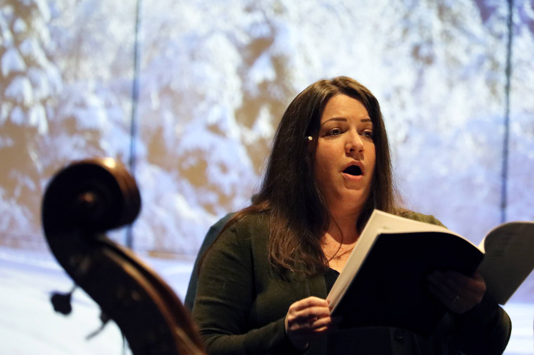 Ben Hohenstatt / Juneau Empire 
Sara Radke Brown, director of Vox Borealis, sings during rehearsal for “Wolf Songs.” The musical event will open at 7:30 p.m. on Friday.