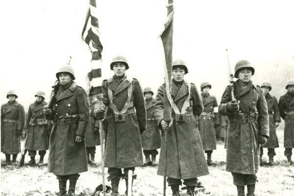 Courtesy photo / United States Army Signal Corps 
The Color Guard of the 442nd RCT stands at attention while citations are read following the fierce fighting in the Vosges area of France on November 12, 1944.