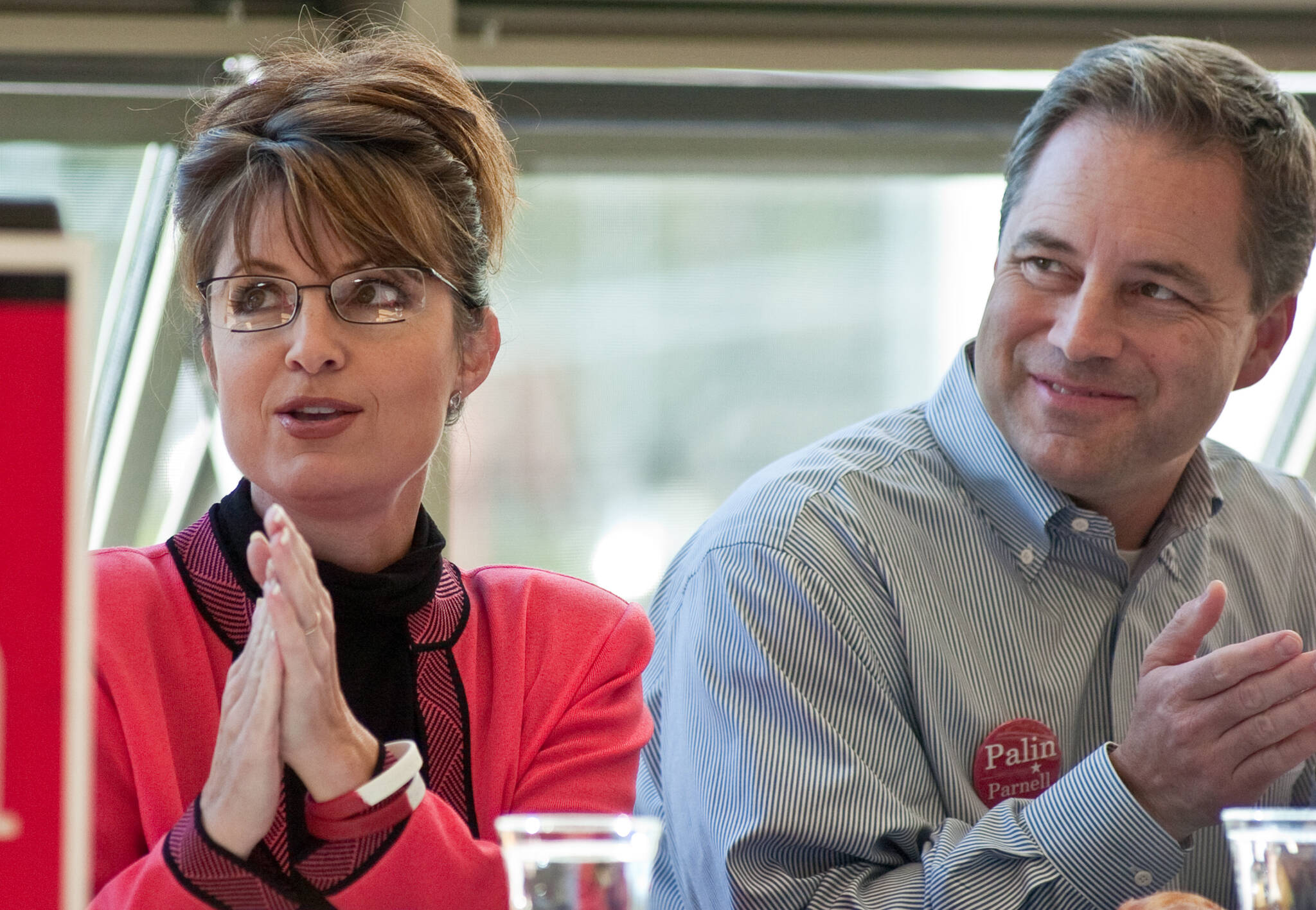 Then-canidate for governor Sarah Palin and running mate Sean Parnell listen to introductions during a Capital City Republican Women’s luncheon at the UAS Recreation Center in September 2006. (Michael Penn / Juneau Empire file)
