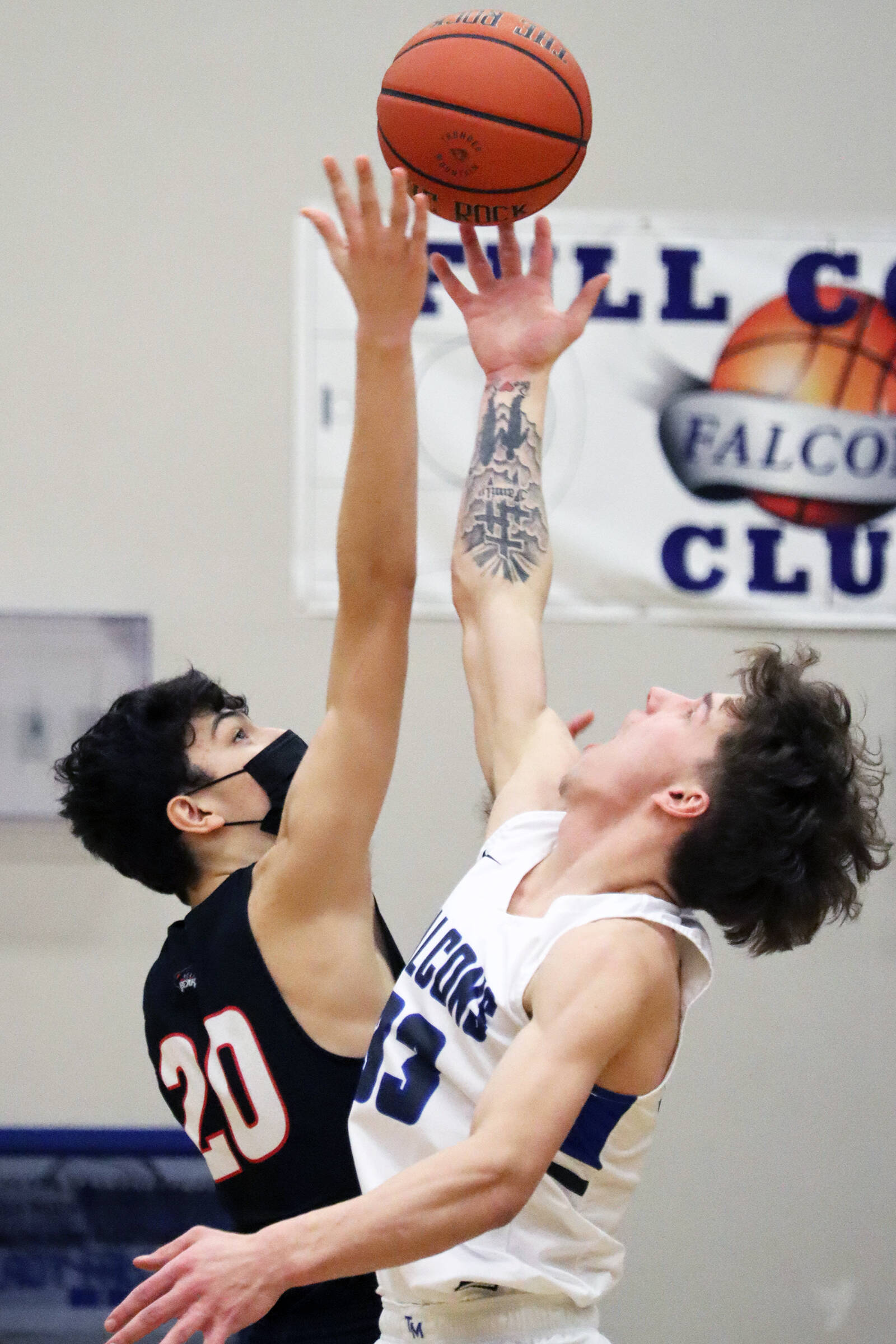 Orion Dybdahl and Thomas Baxter jump during tipoff in an earlier game between JDHS and TMHS. The two schools will meet again on Friday and Saturday. The games will have Region V Tournament seeding implications for JDHS. (Ben Hohenstatt / Juneau Empire File)