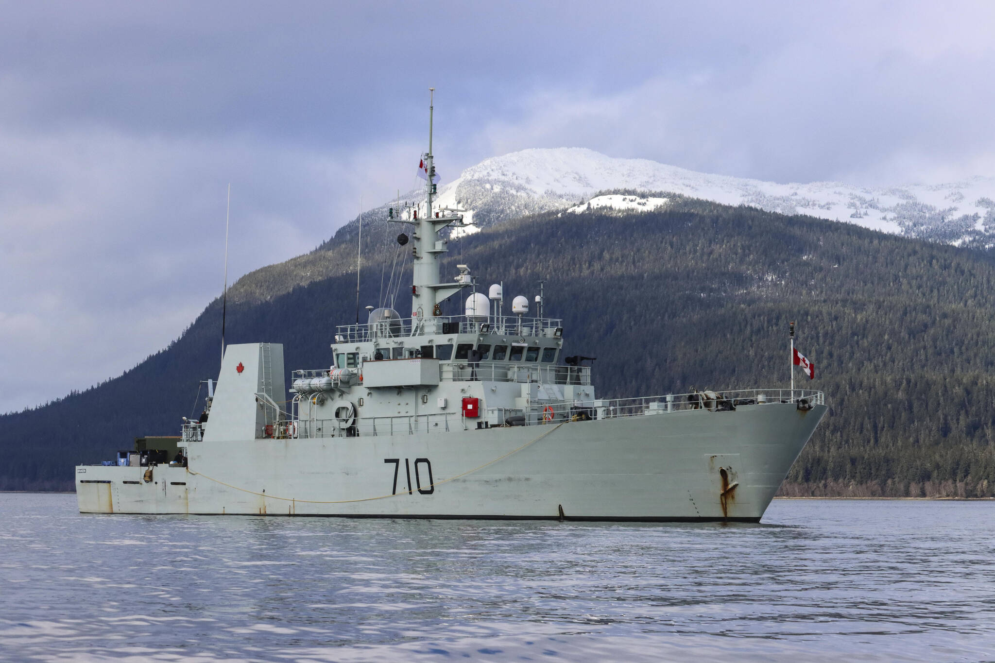 Her Majesty’s Canadian Ship Brandon lies at anchor in the Stephens Passage as divers investigate a simulated naval mine on March 6, 2022, as part of exercise Arctic Edge 2022. (Michael S. Lockett / Juneau Empire)
