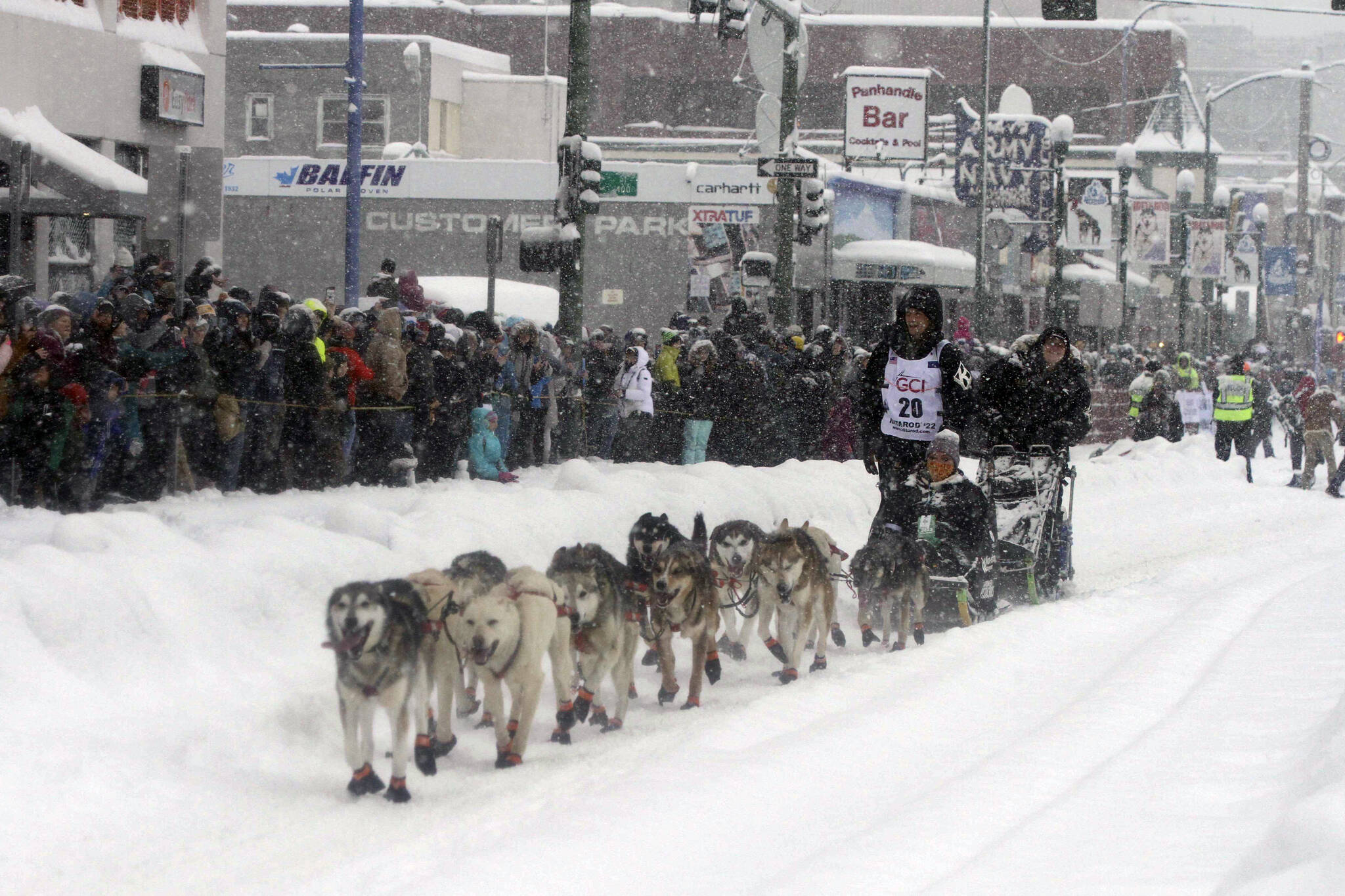 Five-time winner Dallas Seavey takes his sled dog team through a snowstorm in downtown Anchorage, Alaska, on Saturday, March 5, 2022, during the ceremonial start of the Iditarod Trail Sled Dog Race. The competitive start of the nearly 1,000-mile race will be held March 6, 2022, in Willow, Alaska, with the winner expected in the Bering Sea coastal town of Nome about nine days later. (AP Photo / Mark Thiessen)