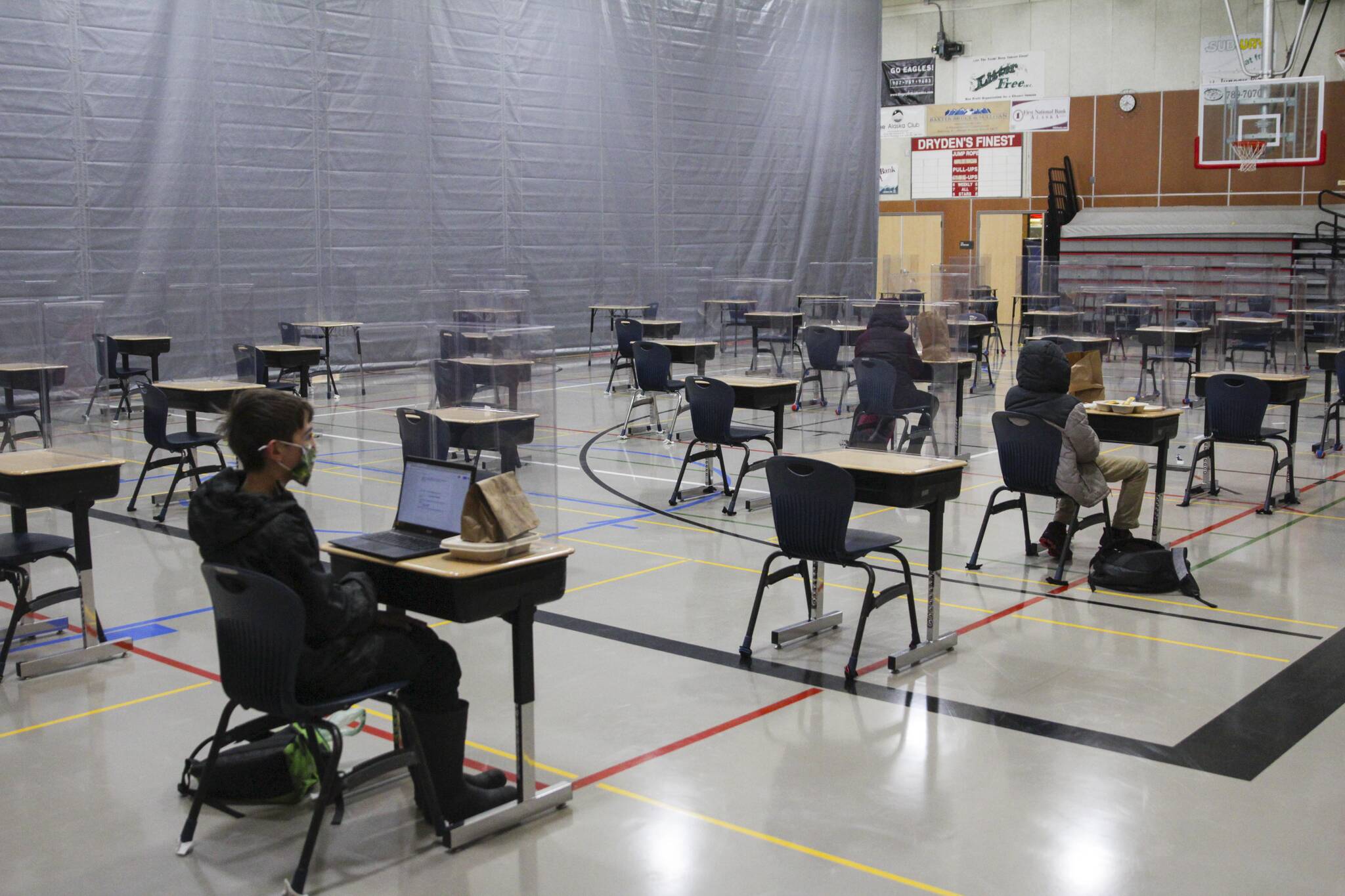 This Empire file photo shows students at Floyd Dryden Middle School, Jan. 11, 2021, with desks separated to accommodate for COVID-19 social distancing protocols. The Juneau School District announced masks would become optional indoors on April 4, 2022. (Michael S. Lockett / Juneau Empire file)