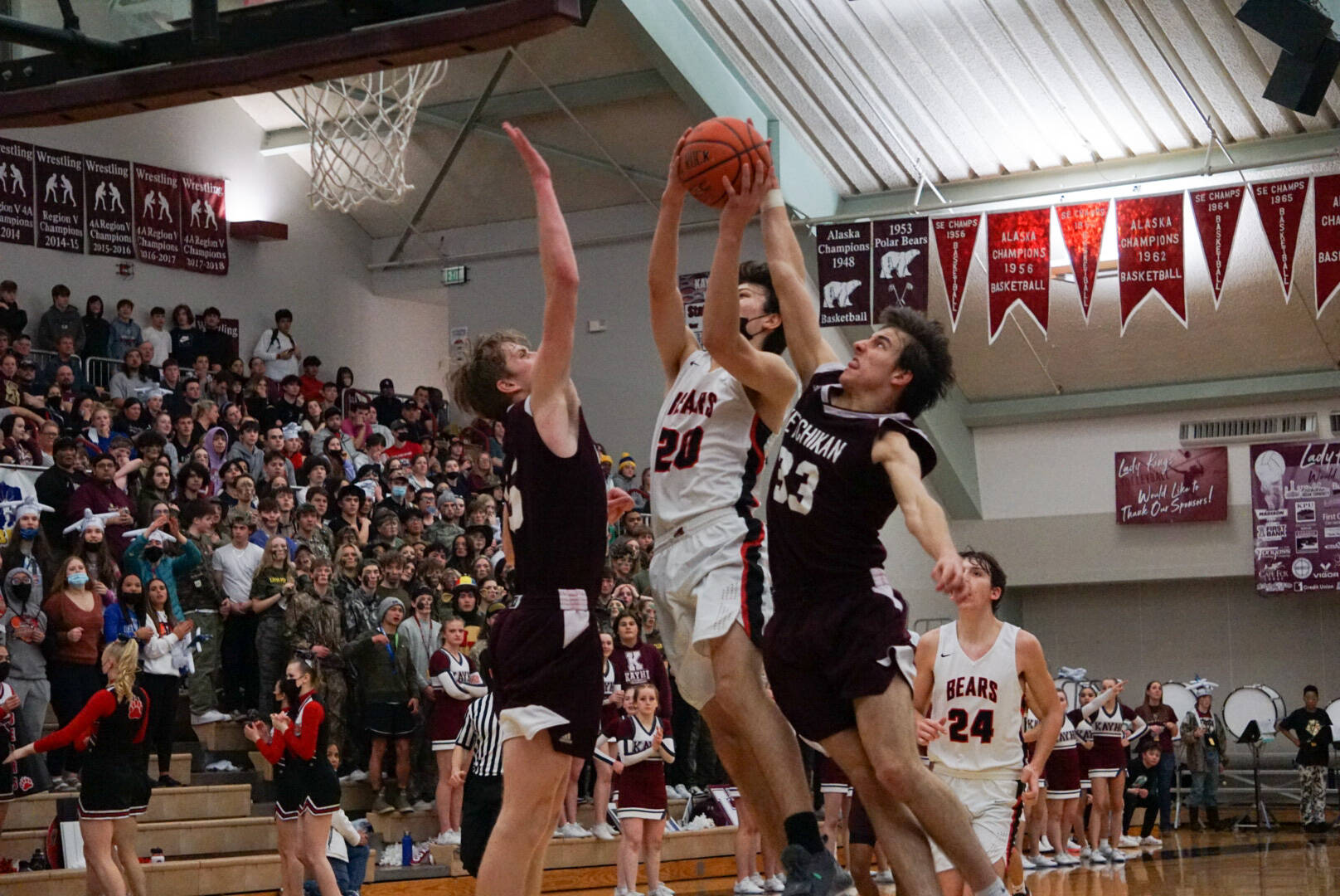 JDHS' Orion Dybdahl (20), a junior, rises for a shot in the Region V 4A Tournament championship game against Ketchikan High School. A buzzer-beater by Dybdahl secured the Crimson Bears and tournament win and state tournament berth. (Jeff Lund / Courtesy Photo)