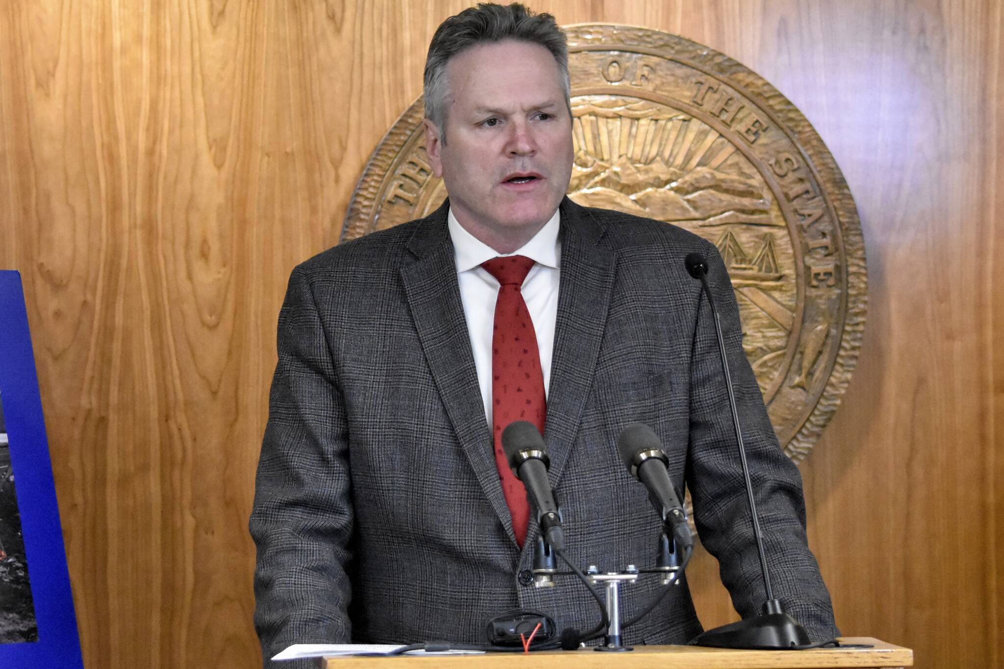 Gov. Mike Dunleavy speaks at a March 8, news conference at the Alaska State Capitol. On Tuesday, Dunleavy released the state's updated revenue forecast and called for Permanent Fund Dividend payments of $3,700. (Peter Segall / Juneau Empire file)