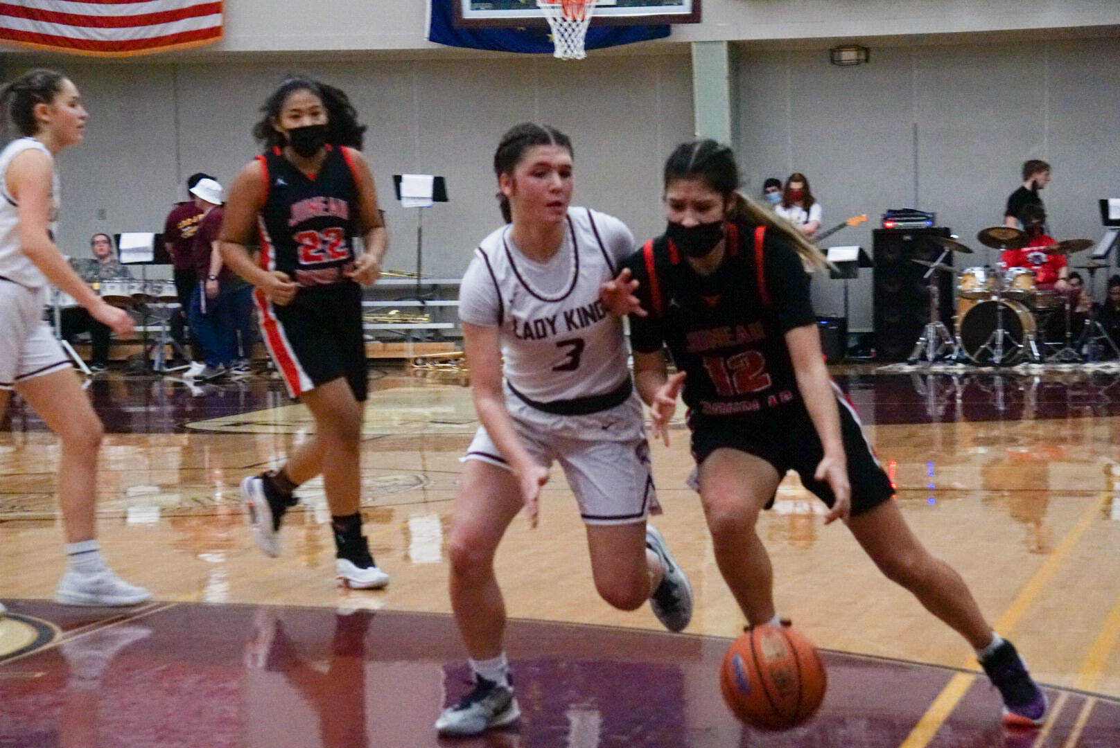 JDHS Trinity Jackson (12) dribble while defended by KHS Paige Boehlert (3) during the Region V 4A championship game. Ketchikan High School won the tournament, securing an automatic berth in the state tournament. Juneau-Douglas High School: Yadaa.at Kalé will find out Sunday if they will be heading to state, too. (Courtesy Photo / Jeff Lund)