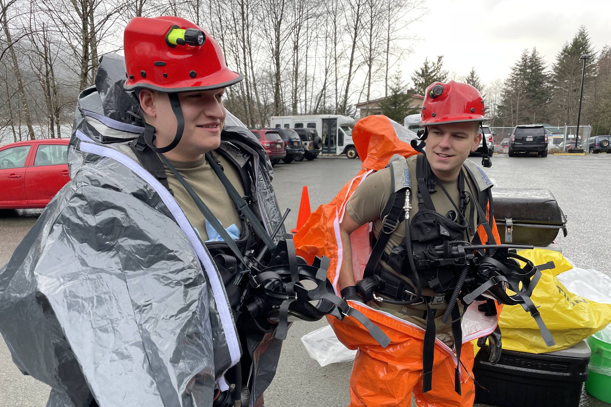 National Guardsmen Sgt. Andrew Hunt and Sgt. Jason Williams, survey team members for the 103rd Civil Support Team, suit up as they prepare to investigate a simulated hazardous material situation in an exercise with Juneau’s emergency organizations on march 22, 2022. (Michael S. Lockett / Juneau Empire)