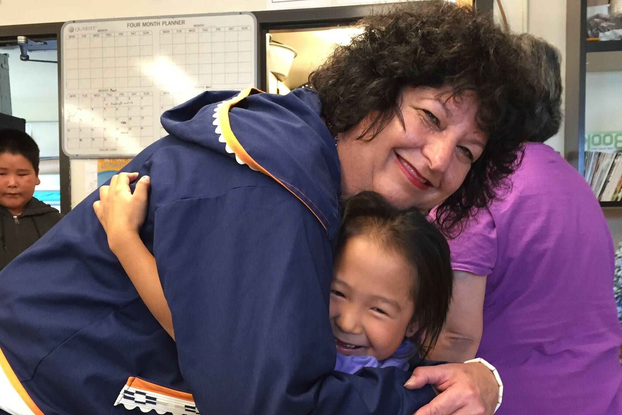 Diane Kaplan connects with a child during a 2017 visit with the Foundation Board to Oscarville on the Kuskokwim River near Bethel. (Courtesy photo / Rasmusen Foundation)