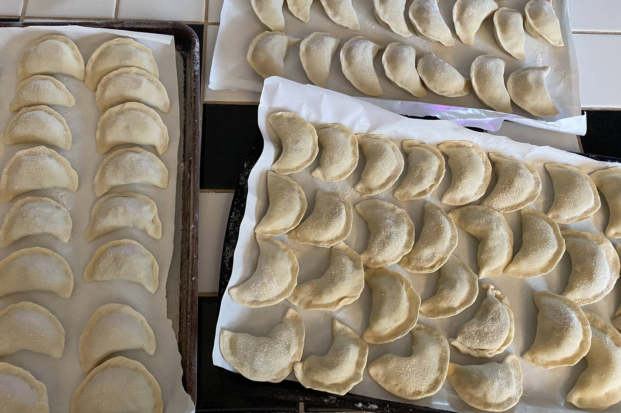 Dozens of Ukranian dumplings, called varenyky, sit after being prepared for a benefit dinner and silent auction to benefit children in war-torn Ukraine on Friday, March 25, 2022. (Courtesy photo / Olena Zyuba)