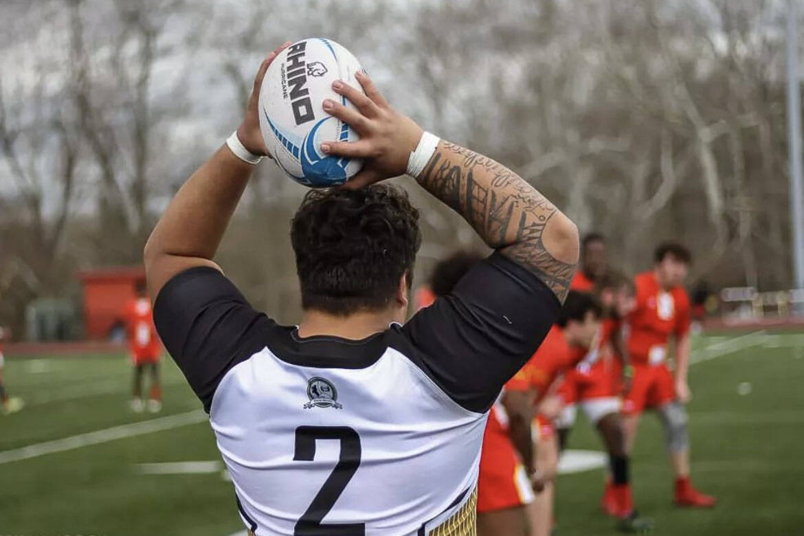 Lance Fenumiai, Juneau local and rugby player for St. Vincent College and recently named All-American by National Collegiate Rugby, prepares to throw the ball in during a game against Wheeling University. (Terry Hancock / Wheeling University)