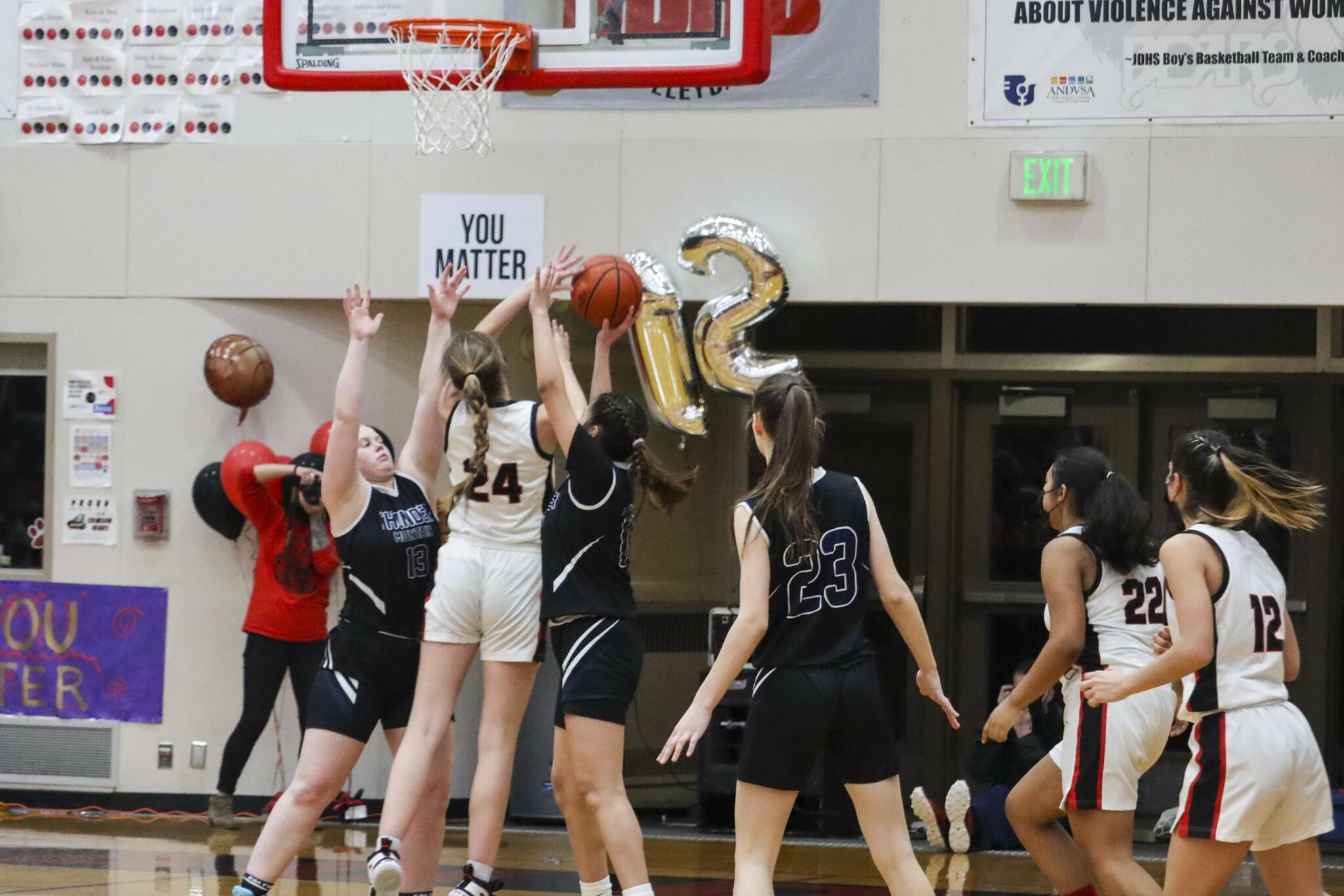 JDHS’ Mila Hargrave (24) sinks a shot during a game against TMHS on March 5, 2022. JDHS would go on to win the match. (Michael S. Lockett / Juneau Empire)