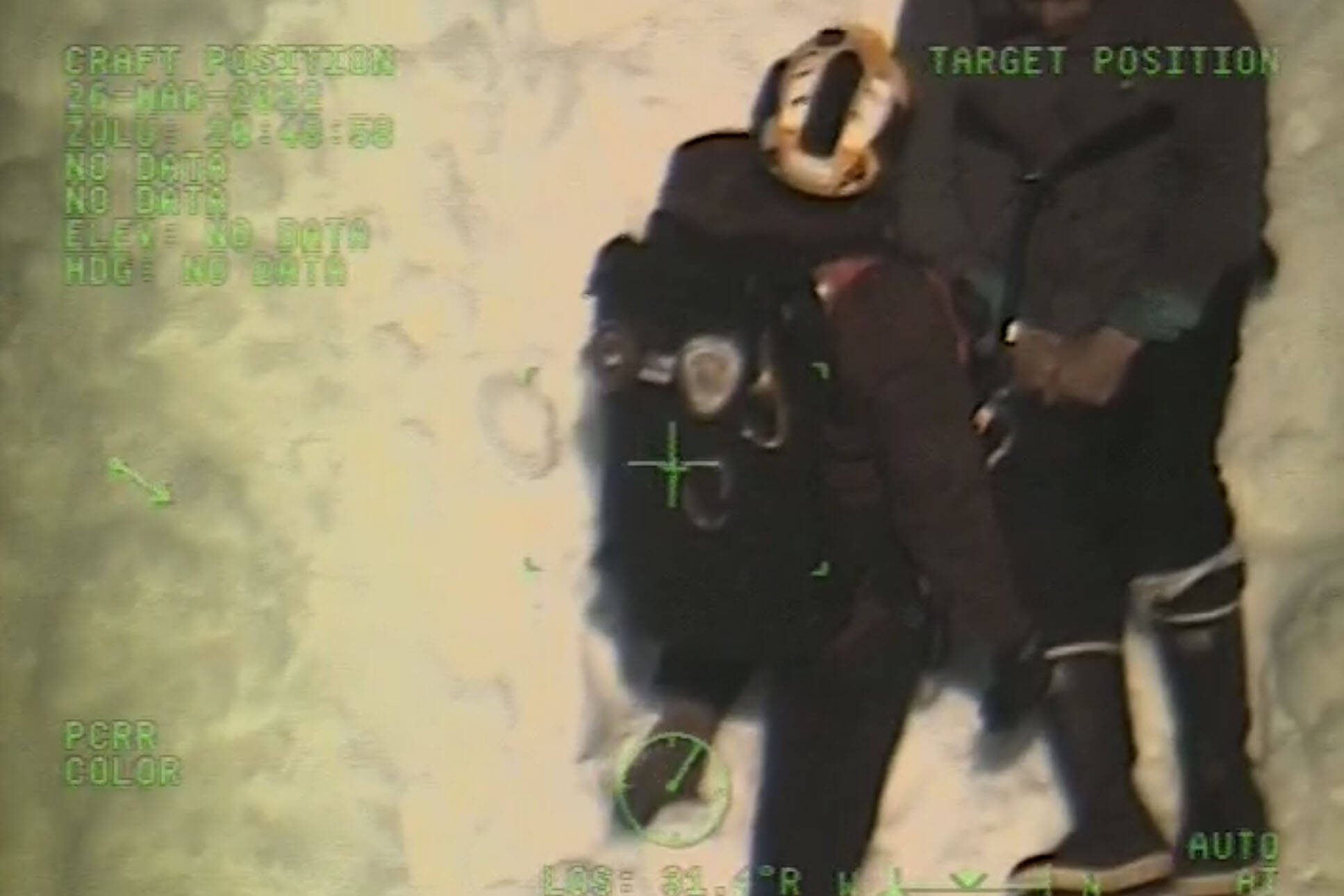A Coast Guardsmen rescues a 70-year-old man who fell off Mt. Verstovia while hiking on March 26, 2022. (Screenshot / USCG)