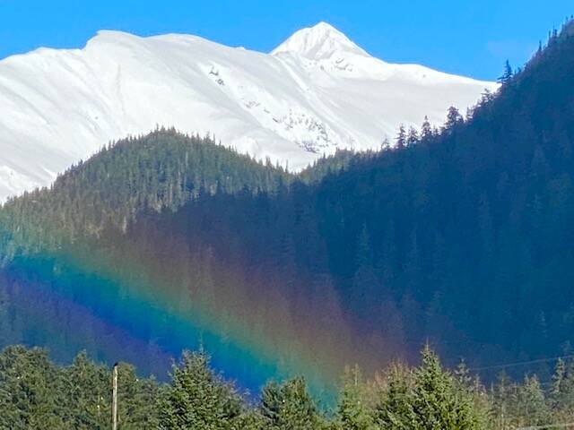 A sprinkle of rain on a seemingly blue sky day brings a rainbow to the Lemon Creek area on March 26. (Courtesy Photo / Denise Carroll)