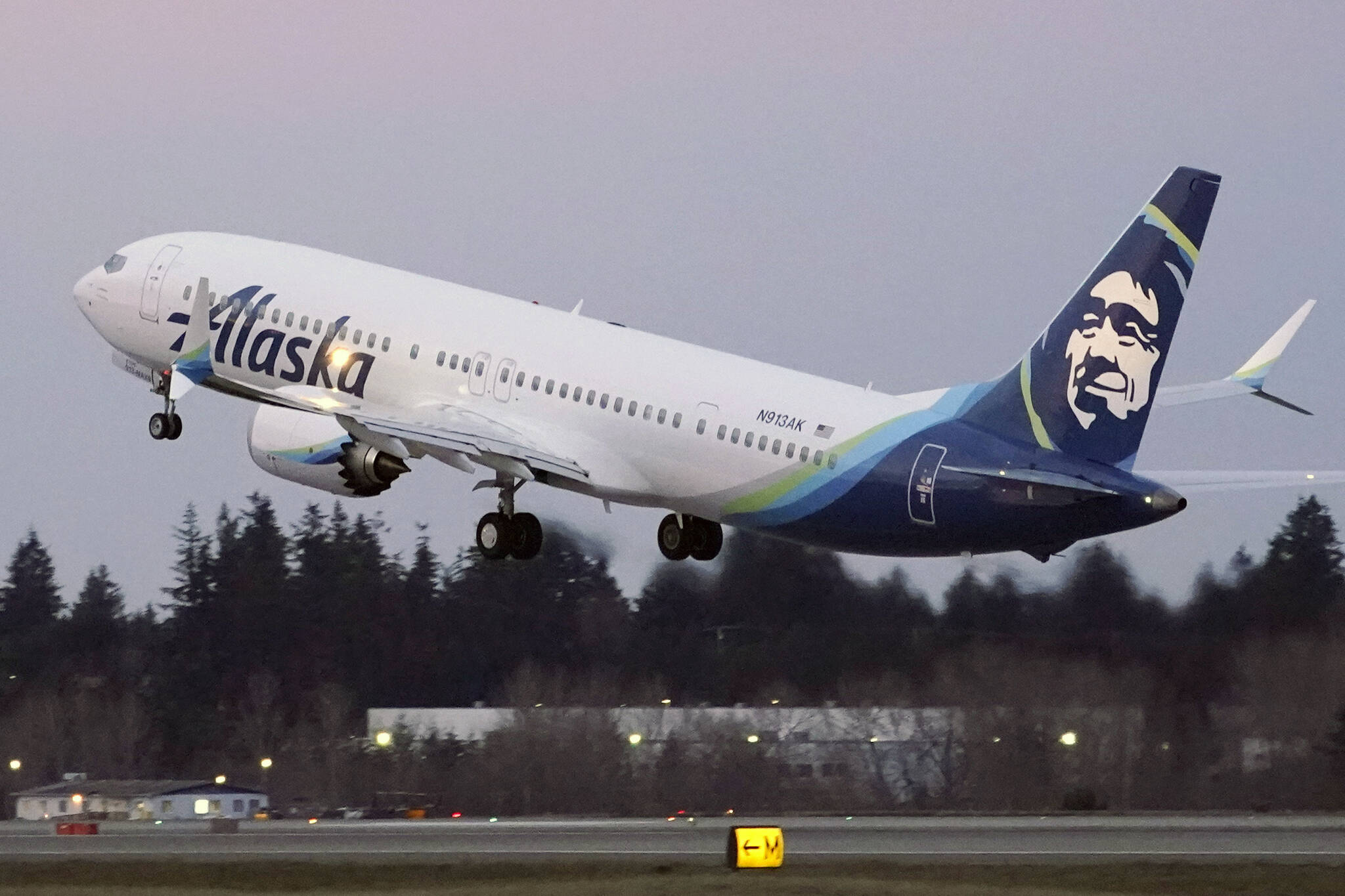 The first Alaska Airlines passenger flight on a Boeing 737-9 Max airplane takes off on a flight to San Diego from Seattle-Tacoma International Airport in Seattle on Monday, March 1, 2021. Dozens of flights along the U.S. West Coast were canceled Friday, April 1, 2022 as Alaska Airlines pilots picketed during ongoing contract negotiations with the airline. (AP Photo / Ted S. Warren)