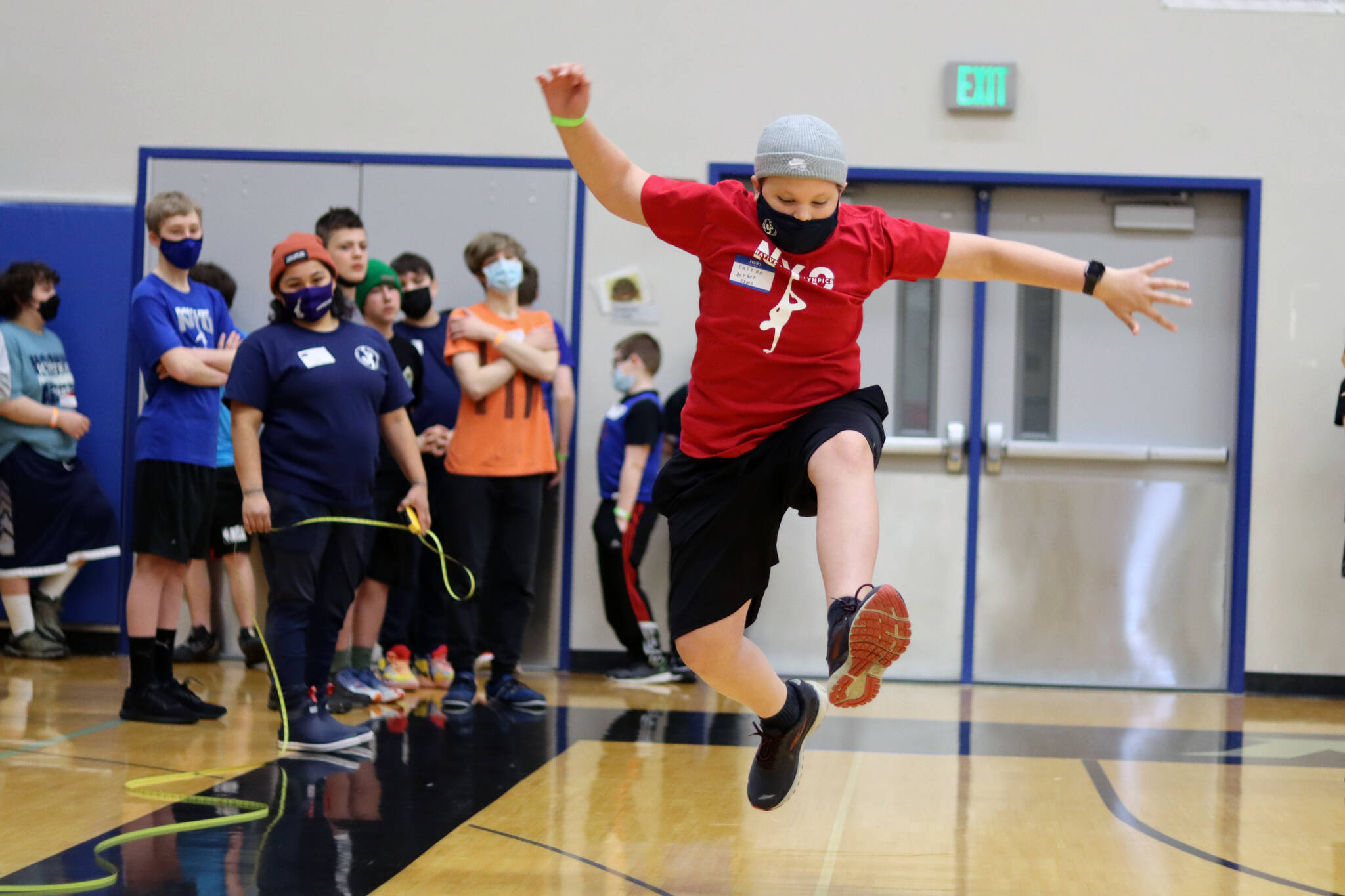 Easton Berger, 13, a Floyd Dryden Middle School student competes in the scissor broad jump Saturday during the 2022 Traditional Games held at Thunder Mountain High School. This year’s games, which feature 10 events, were held in person after multiple pandemic-marred years. Berger said he was happy to see them return to an in-person format. Berger said the Denè stick pull is his favorite event. He placed first in it among middle school boys. (Ben Hohenstatt / Juneau Empire)