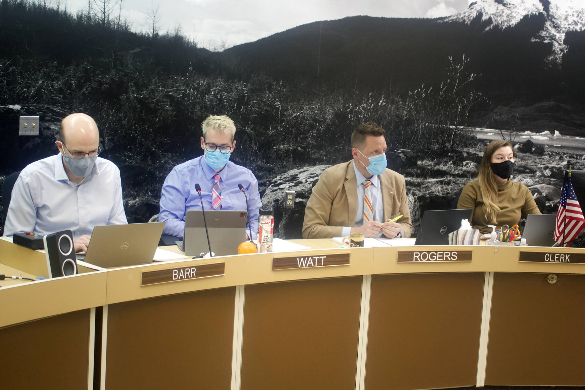 Robert Barr, deputy city manager; Rorie Watt, city manager; Jeff Rogers, city finance director and Adrien Speegle, a budget analyst, participate Wednesday night in a City and Borough of Juneau Assembly Finance Committee meeting. (Mark Sabbatini / Juneau Empire)