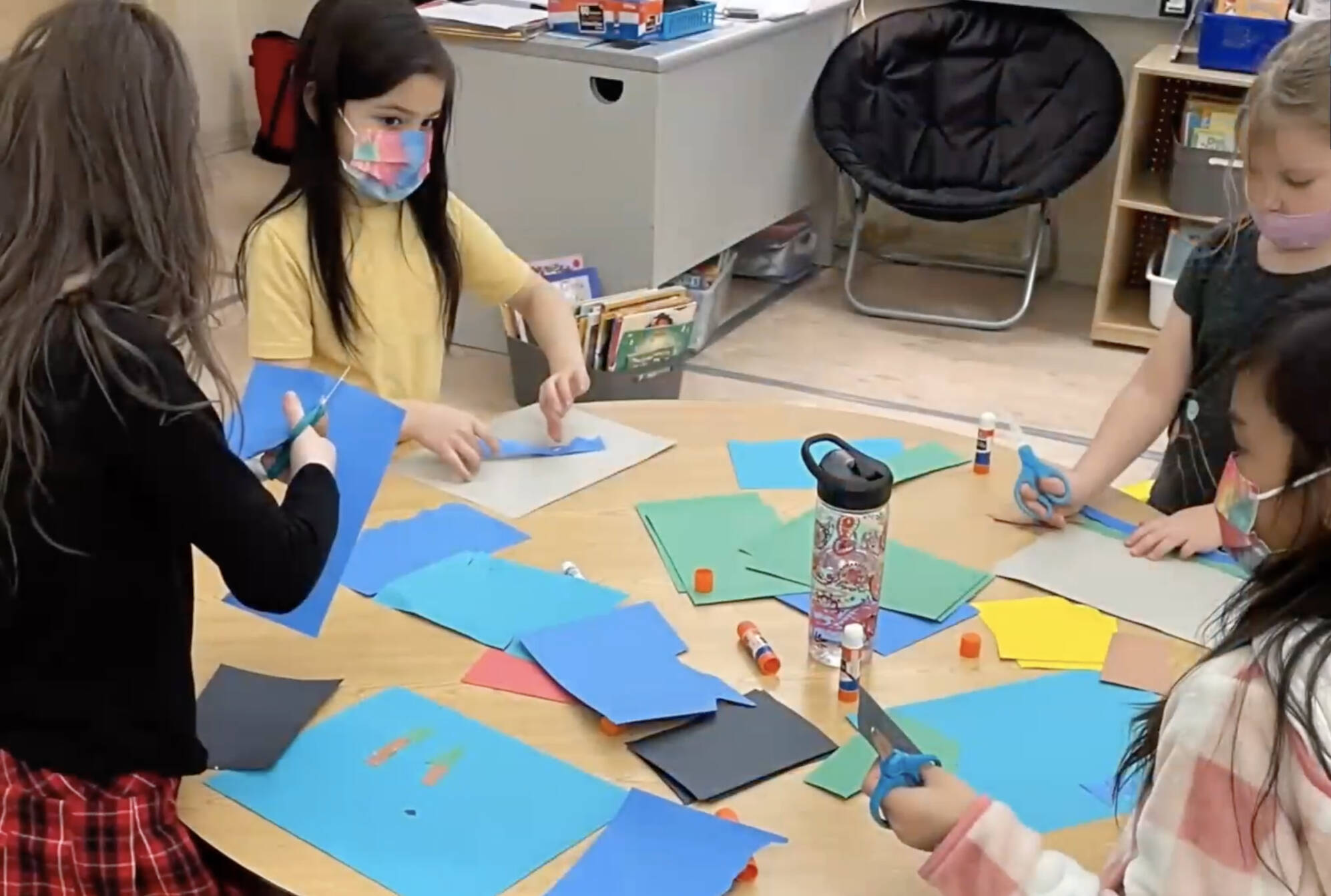 This screenshot from a video shown during a Juneau School District Board of Education meeting shows Riverbend Elementary School students working on a project. The school may soon have a new name, Kaxdigoowú Héen Elementary School. The name translates to going back to clear water, in English. (Screenshot)