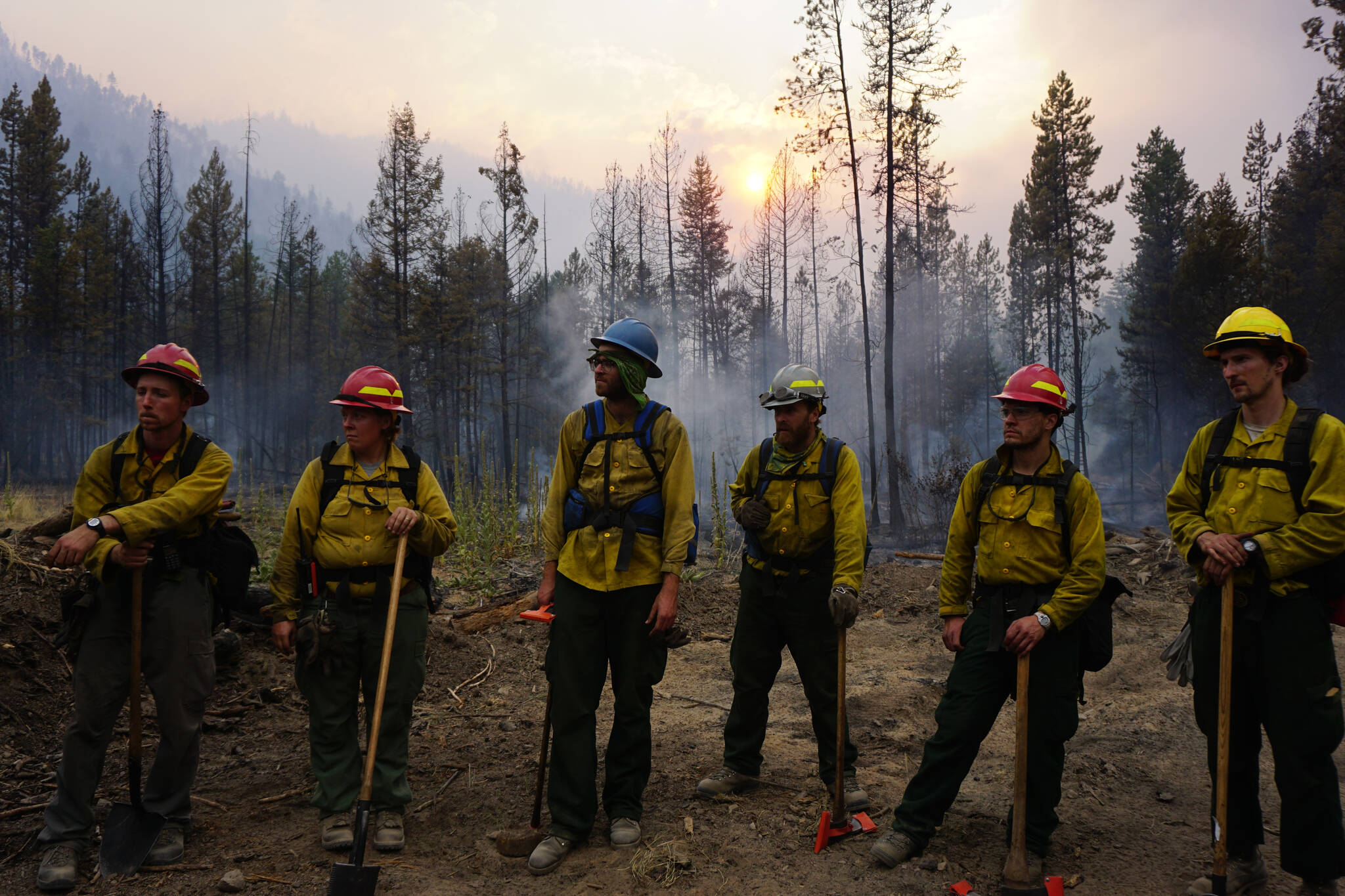 A Forest Service fire crew gets brief during an operation. Fire crews from Alaska are frequently deployed to the Lower 48 to help combat wildfires that are growing larger and closer to urban areas in many cases. (Courtesy photo / Parker Anders)