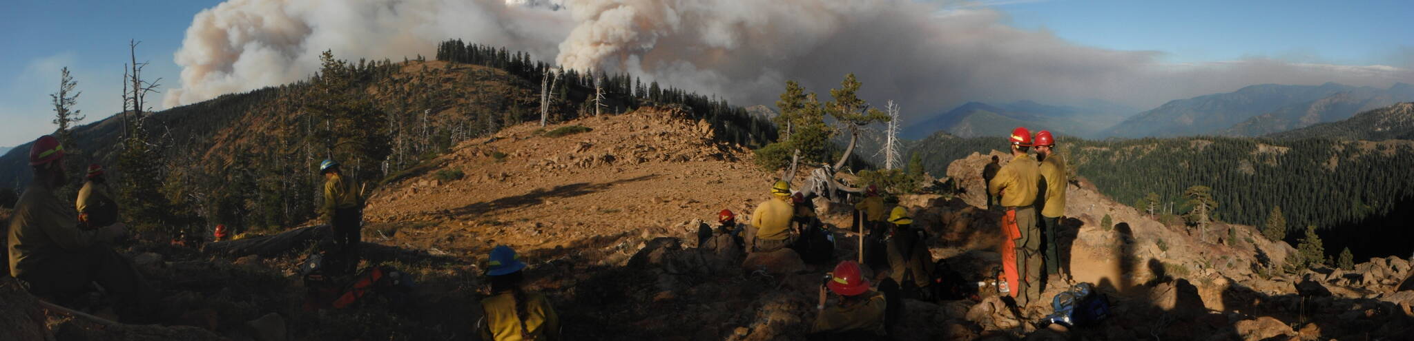 Courtesy photo / Parker Anders
A Forest Service fire crew surveys a break in a ridgeline during an operation. Fire crews from Alaska are frequently deployed to the Lower 48 to help combat wildfires that are growing larger and closer to urban areas in many cases.