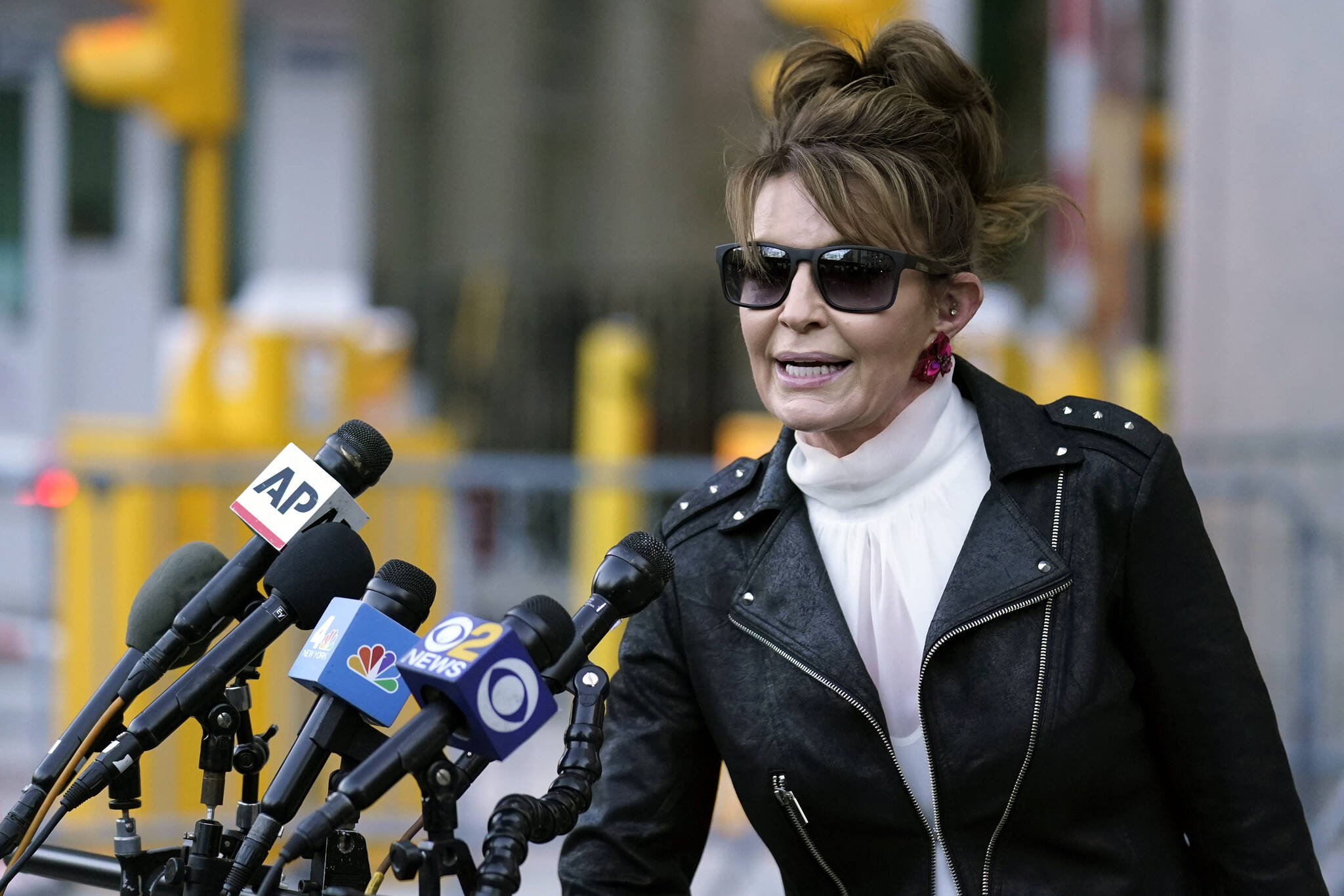 Former Alaska Gov. Sarah Palin speaks briefly to reporters as she leaves a courthouse in New York, Feb. 14, 2022. Palin is one of 48 candidates for Alaska’s lone U.S. House seat, which was held for decades by Republican Rep. Don Young, who died last month. Palin says she’s serious about the run though some critics have questioned her motivations. (AP Photo / Seth Wenig)