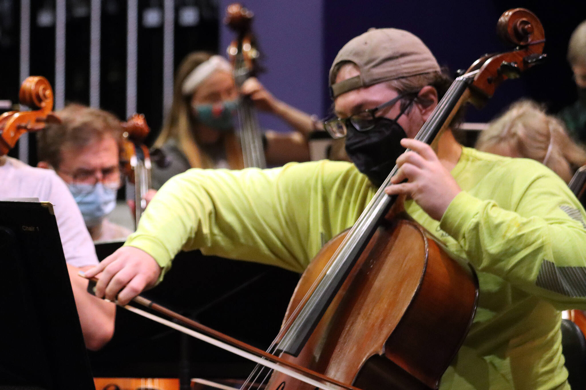 Ben Holtz plays a cello as the Juneau Symphony prepares for this weekend’s concert.