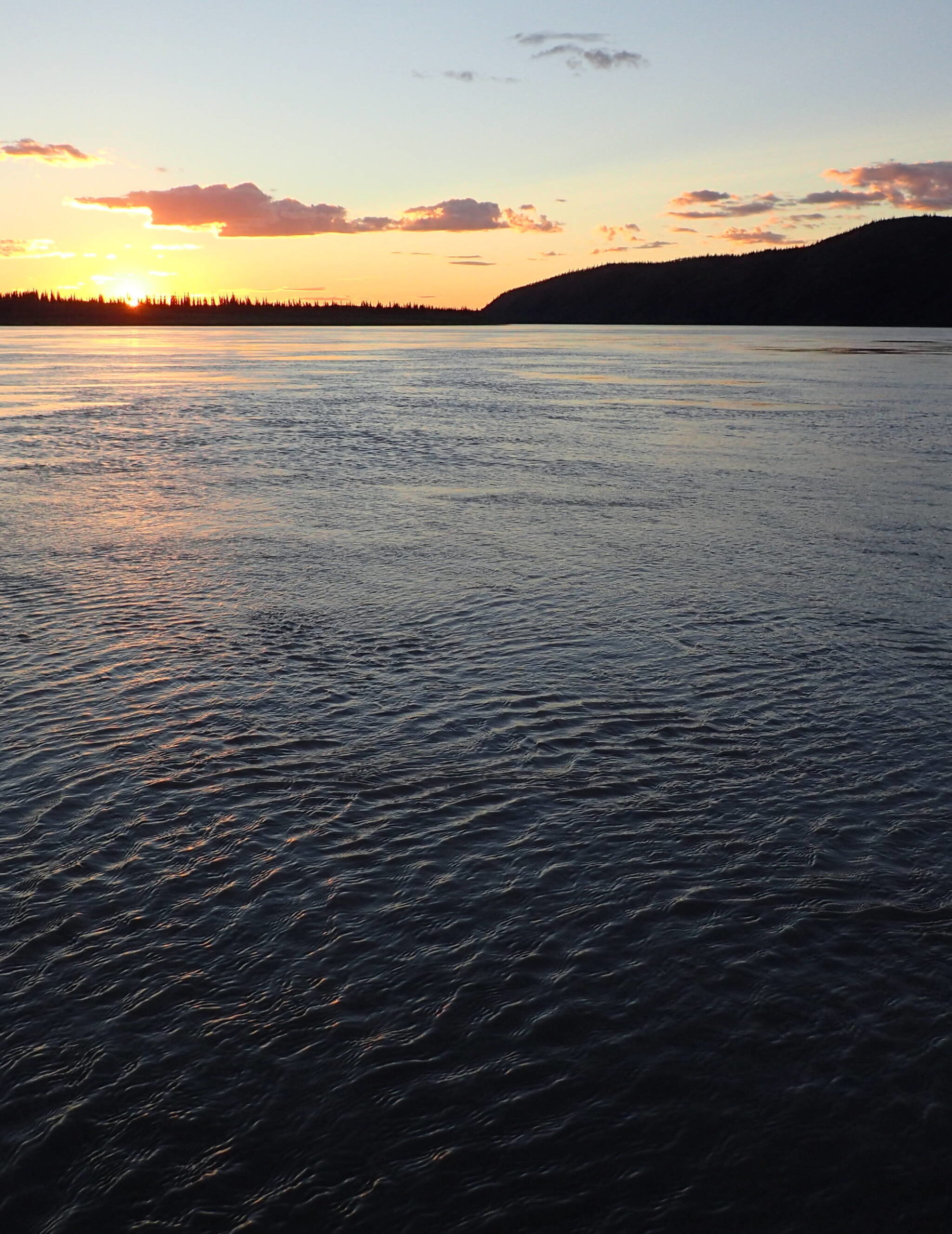 The Yukon River flows toward Circle, Alaska. Two-thirds of all the flowing water in Alaska makes its way into the Yukon (Courtesy Photo / Ned Rozell)