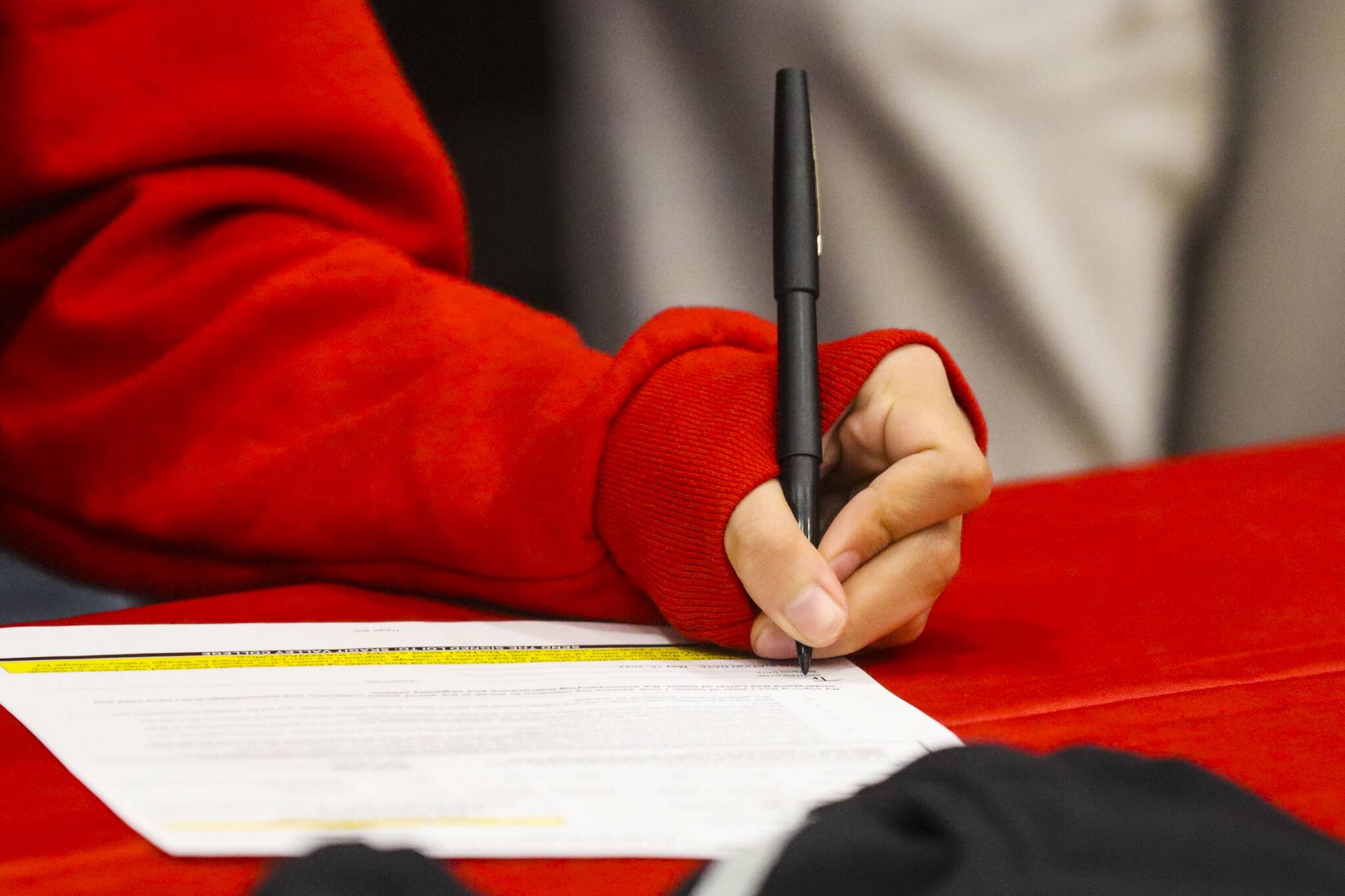 JDHS basketball player Trinity Jackson signs her letter of intent to play basketball for Skagit Valley College on May 4, 2022. (Michael S. Lockett / Juneau Empire)
