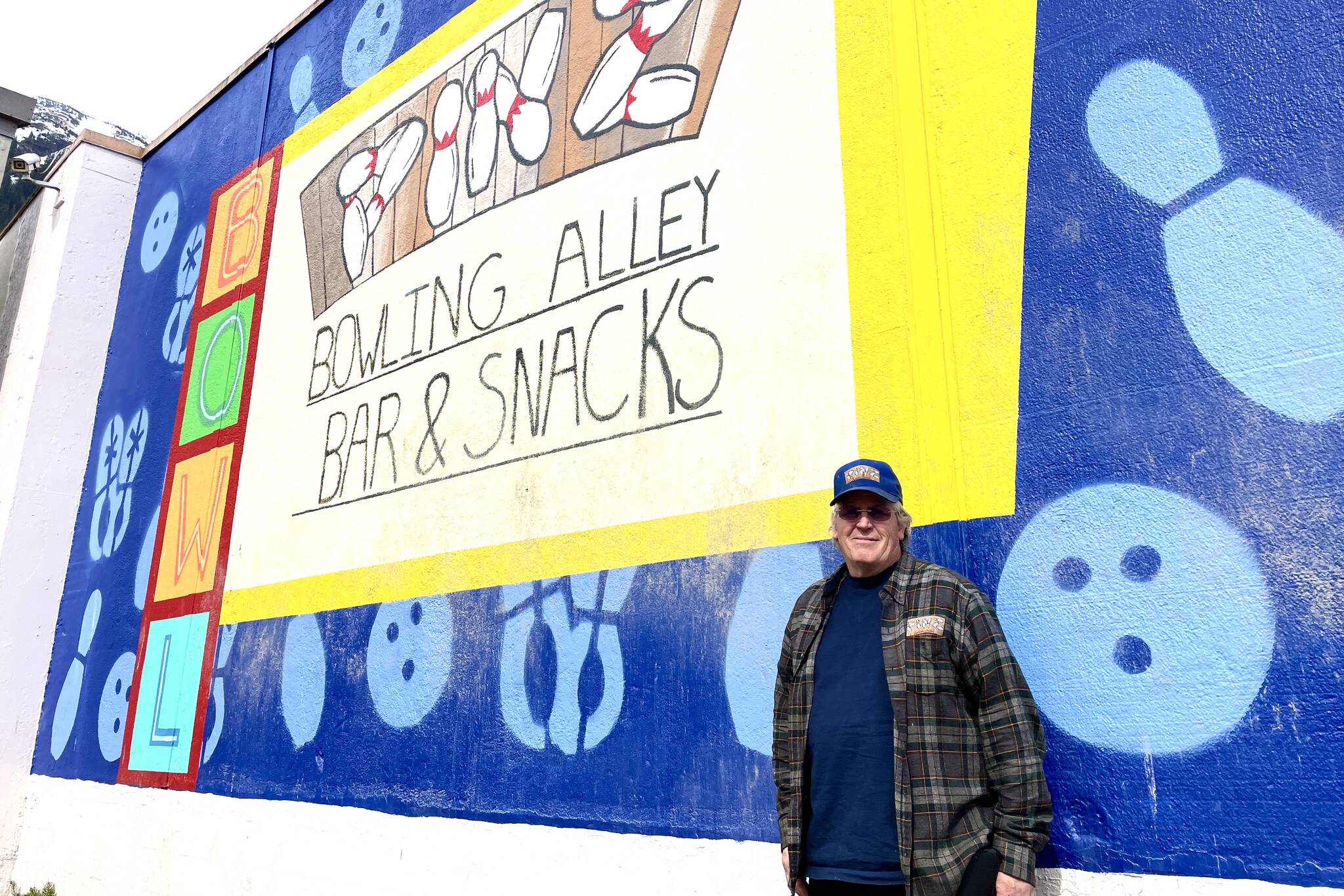 Bob Petersen has spent the last several years restoring and upgrading the bowling alley after previous management left it in ill repair, including commissioning a new mural for the outside wall. (Michael S. Lockett / Juneau Empire)