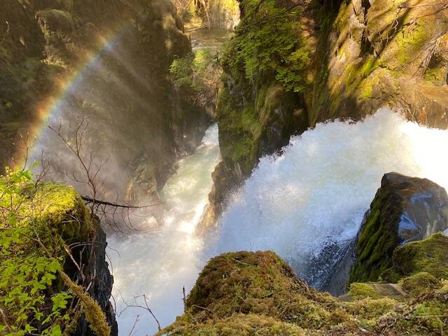 The spray from Sawmill Creek waterfall creates a rainbow over the gorge. (Courtesy Photo / Denise Carroll)