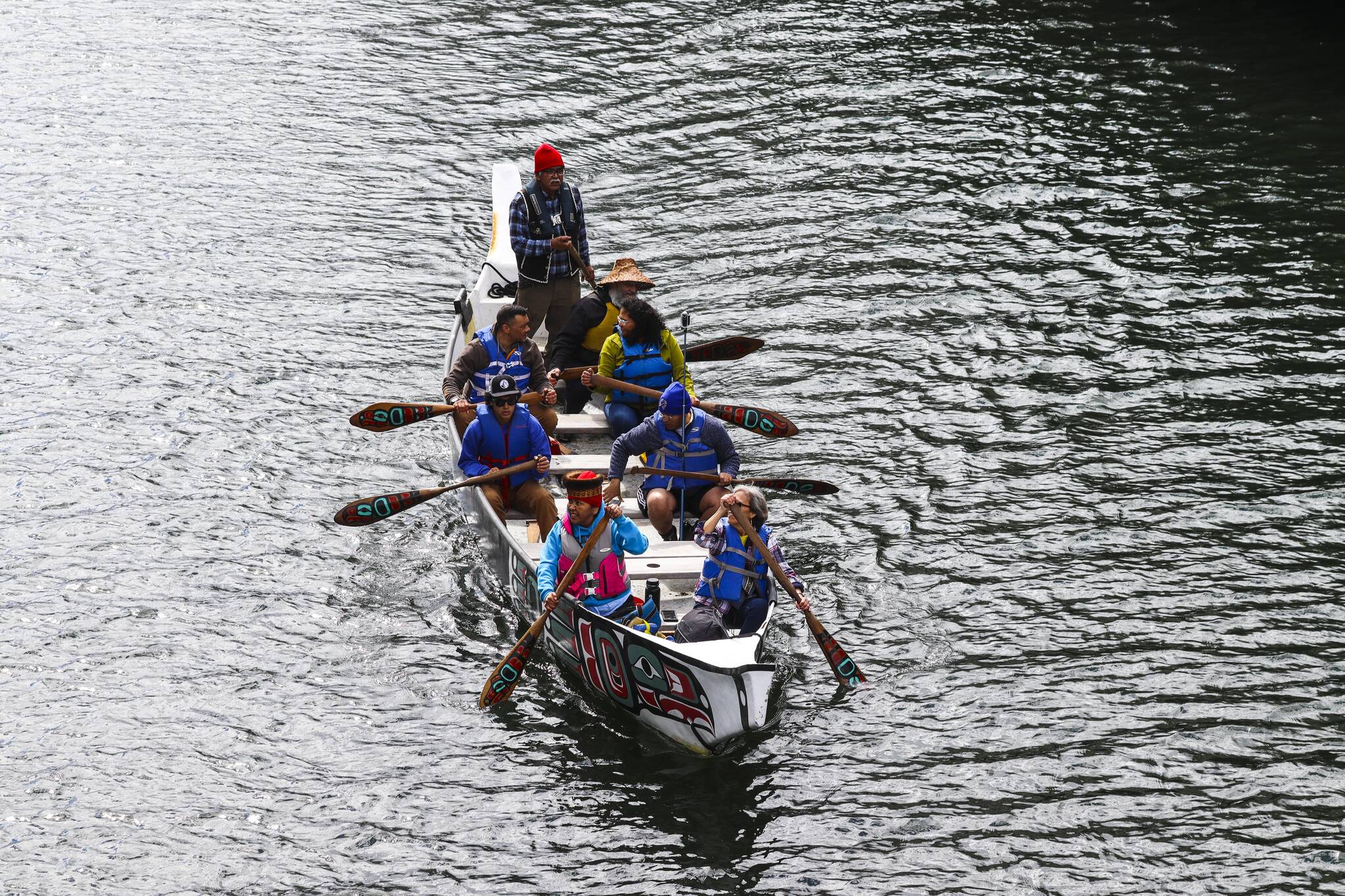 Members of One People Canoe Society paddle through Juneau harbor during the 12th Annual Maritime Festival on May 7, 2022. (Michael S. Lockett / Juneau Empire)