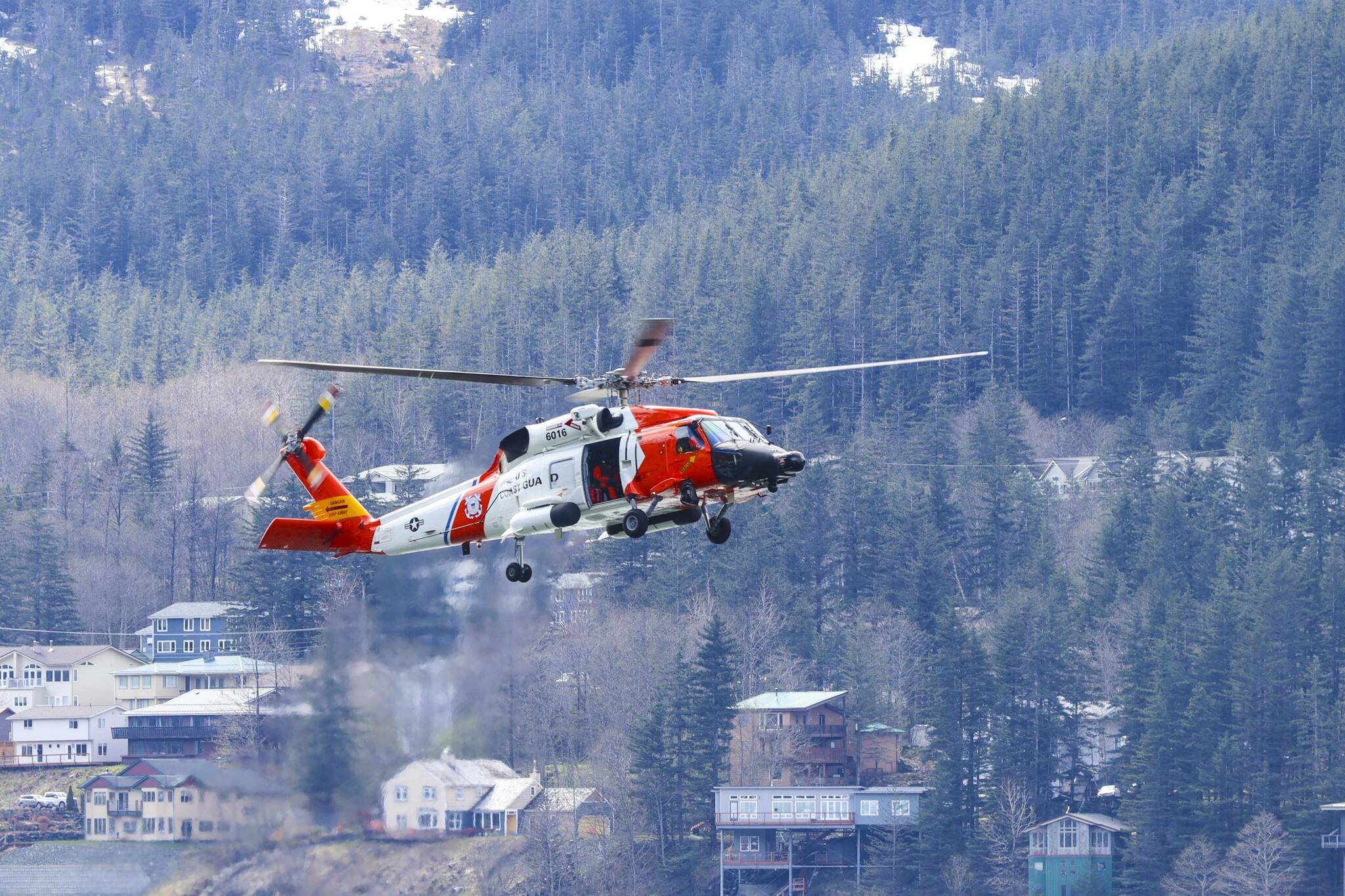 Coast Guard Sector Juneau deployed a number of assets including an MH-60 Jayhawk to search for a woman reported fallen overboard from a cruise ship near the Eldred Rock Lighthouse in the Lynn Canal on. May 17, 2022. (Michael S. Lockett / Juneau Empire File)