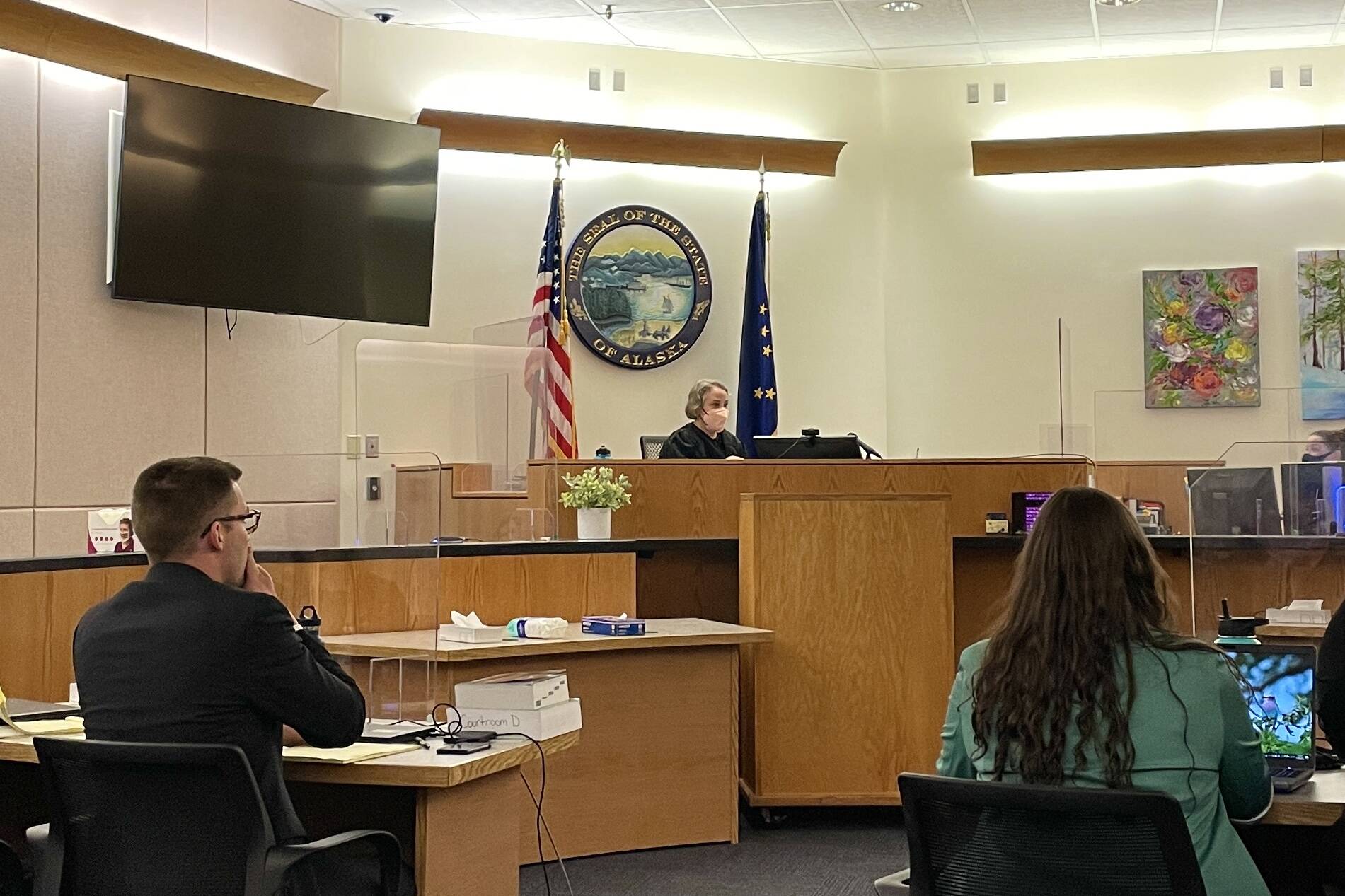 Public defender Nicolas Ambrose, left, and prosecutor Jessalyn Gillum, right, listen to Judge Amy Mead during the trial for a fatal 2019 stabbing on May 18, 2022. (Michael S. Lockett / Juneau Empire)