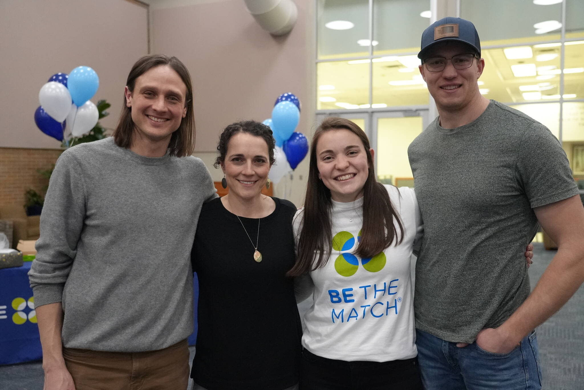 Ryan and Rebecca Bellmore, left, pose with Shawen Bueckers and her husband Mathew Bueckers at a Be the Match event at Brigham Young University in 2022. (Courtesy photo / Be the Match)