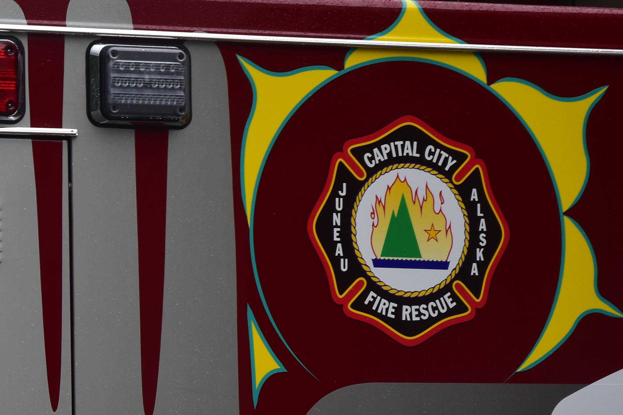 This photo shows the Capital City Fire/Rescue logo that adorns an an ambulance decorated with a formline design. On Friday night, CCFR responded to and extinguished a small fire at a local middle school. (Peter Segall / Juneau Empire File)