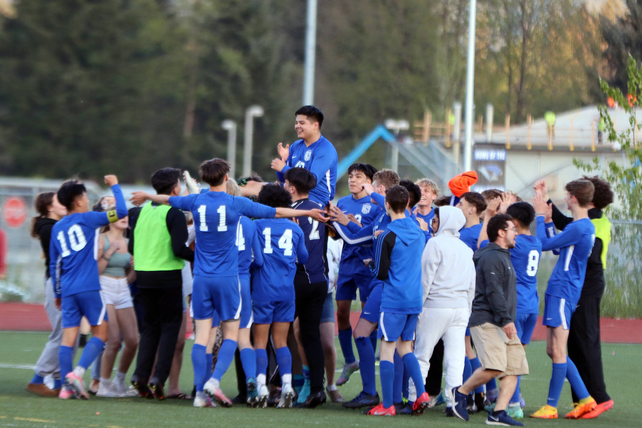 The TMHS boys soccer team hoists senior Omar Alvarez following his four-goal performance Saturday on senior night. Alvarez had not scored a goal all season prior to Saturday. “It felt like a dream, honestly,” Alvarez said of his first goal. “It came to the second half, and I was like, ‘Man I need one more, I want one more.’ Well, looks like I got three more.” (Ben Hohenstatt / Juneau Empire)