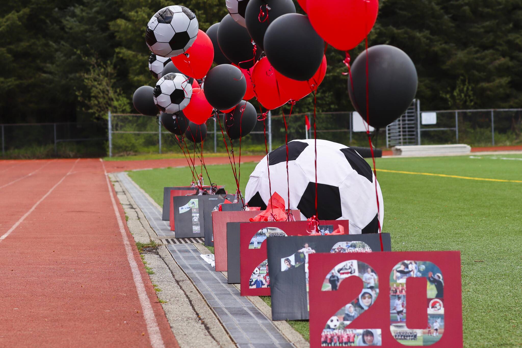 JDHS players and fans recognized seniors Tias Carney, Sam Marnon, Callan Smith, Zayden Schijvens, Samuel Holst, Andre Peirovi, Owen Costello, Ahmed Mezel, Solomon Alper, Will Rehfeldt and Ben Goldstein during senior night on May 22, 2022. They’ll play their final high school games together this week at the state tournament in Anchorage. (Michael S. Lockett / Juneau Empire)