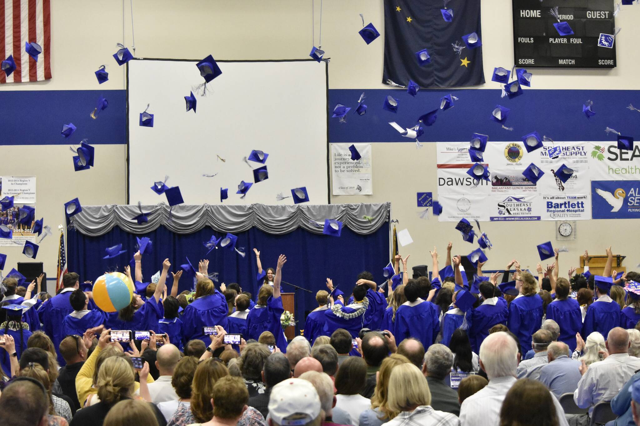 Peter Segall / Juneau Empire
Thunder Mountain High School students throw their caps in celebration at the graduation ceremony for the Class of 2022 on Sunday.