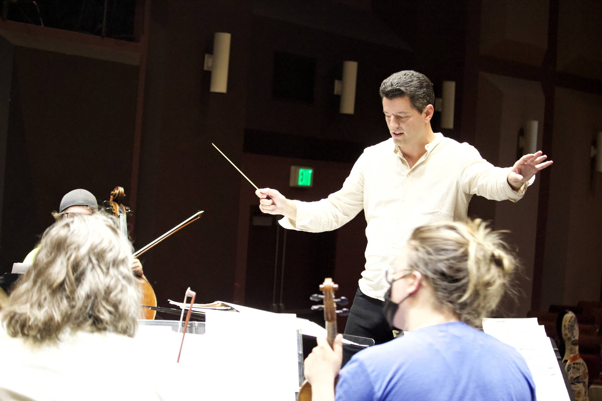 Troy Quinn, former music director of The Juneau Symphony, leads local musicians through their first rehearsal for the upcoming performances of "A Night at the Oscars" scheduled June 11 and 12. The concert was original scheduled as his final conducting appearance in 2020, but delayed due to COVID-19. (Mark Sabbatini / Juneau Empire)