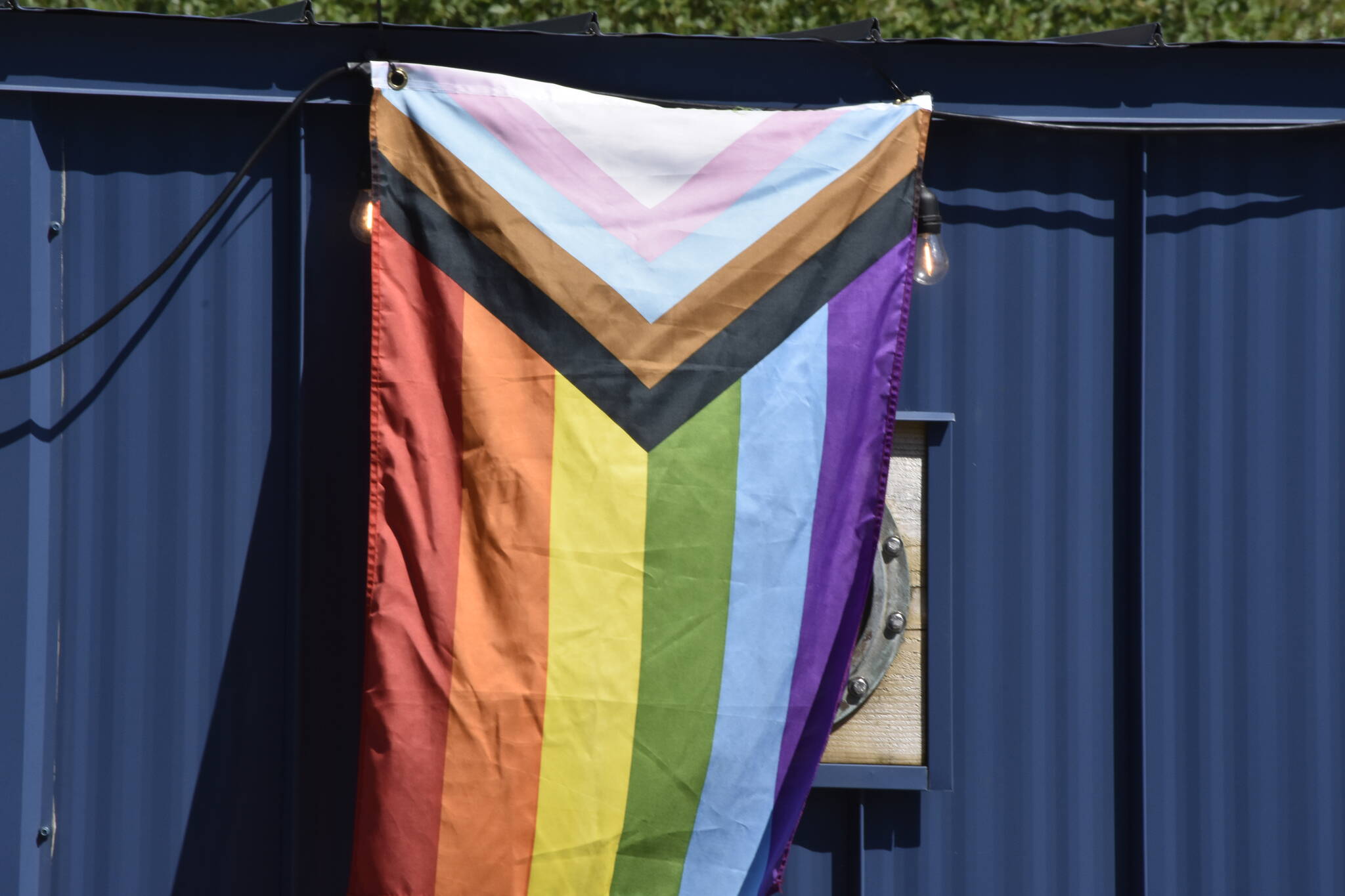 A Pride flag hangs in downtown Juneau on Thursday, June 2, 2022, in honor of June as Pride Month. A number of Juneau’s Pride events are being sponsored by the National Alliance on Mental Illness Juneau, who say LGBTQ youth are at higher risk for depression and suicidal ideation. (Peter Segall / Juneau Empire)