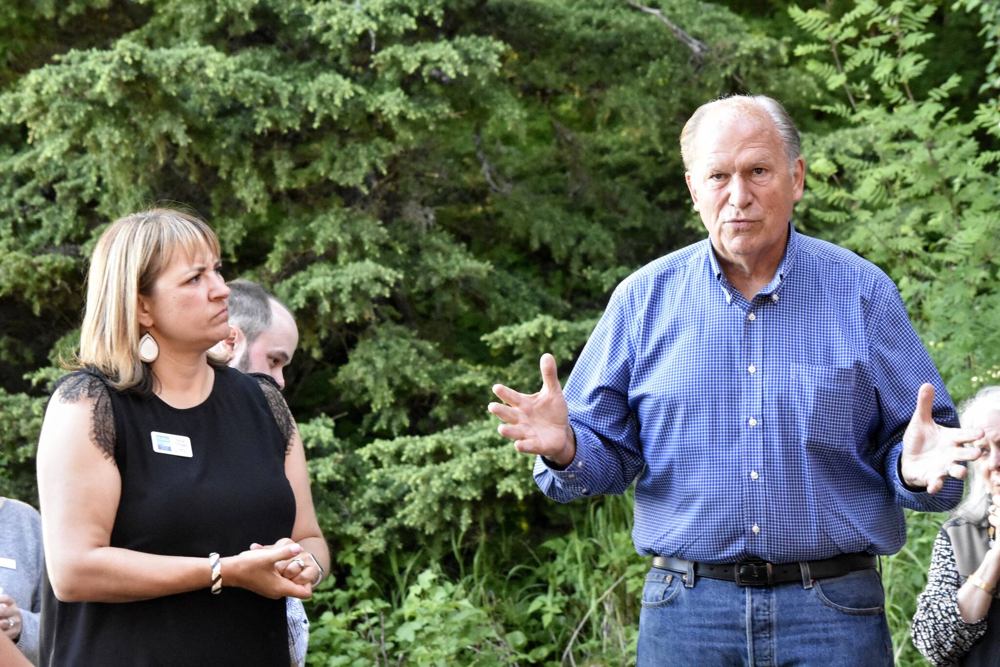 Former Gov. Bill Walker, right, and his running mate former commissioner of the Department of Labor and Workforce Development Heidi Drygas, speak to Juneauites gathered for a fundraiser at a private home in Juneau on Tuesday, June 7, 2022. (Peter Segall / Juneau Empire)
